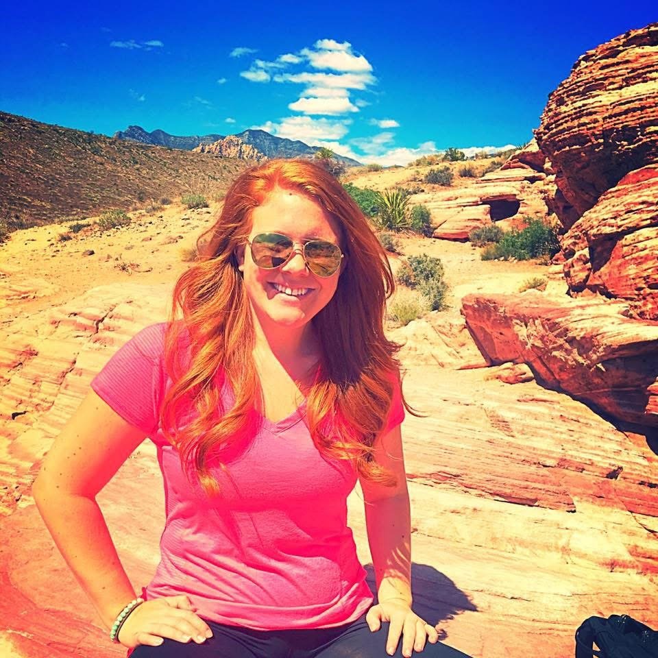 Woman hiking in Red Rock Canyon during a personal healing and self-discovery journey after trauma.