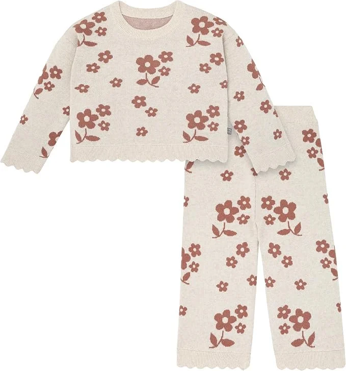 Cream knit sweater and pants set with a rust flower jacquard print and scalloped hem.