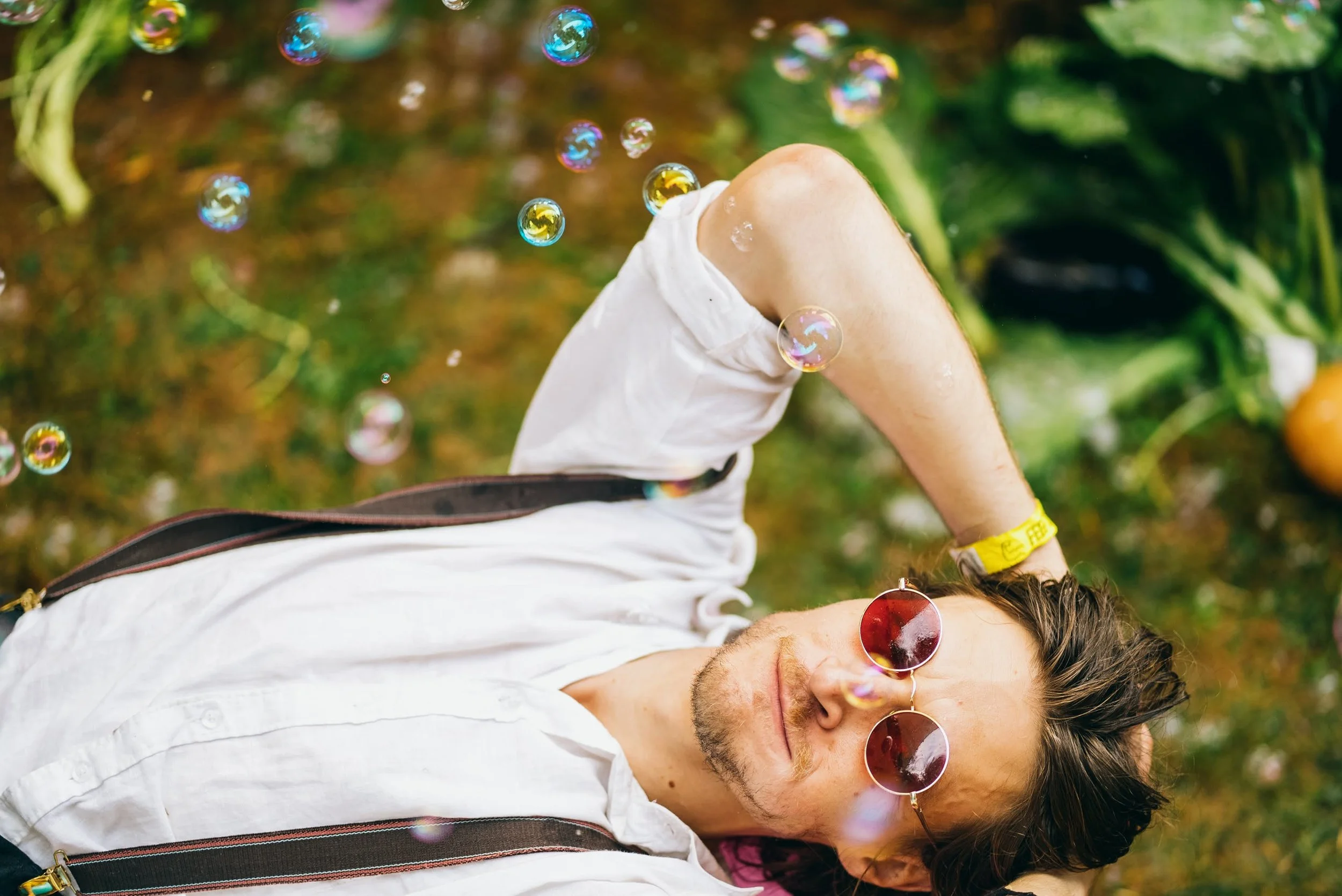An artist at Churning Man Music and Arts Festival imagines what art he will create as he stares at bubbles floating in the sky