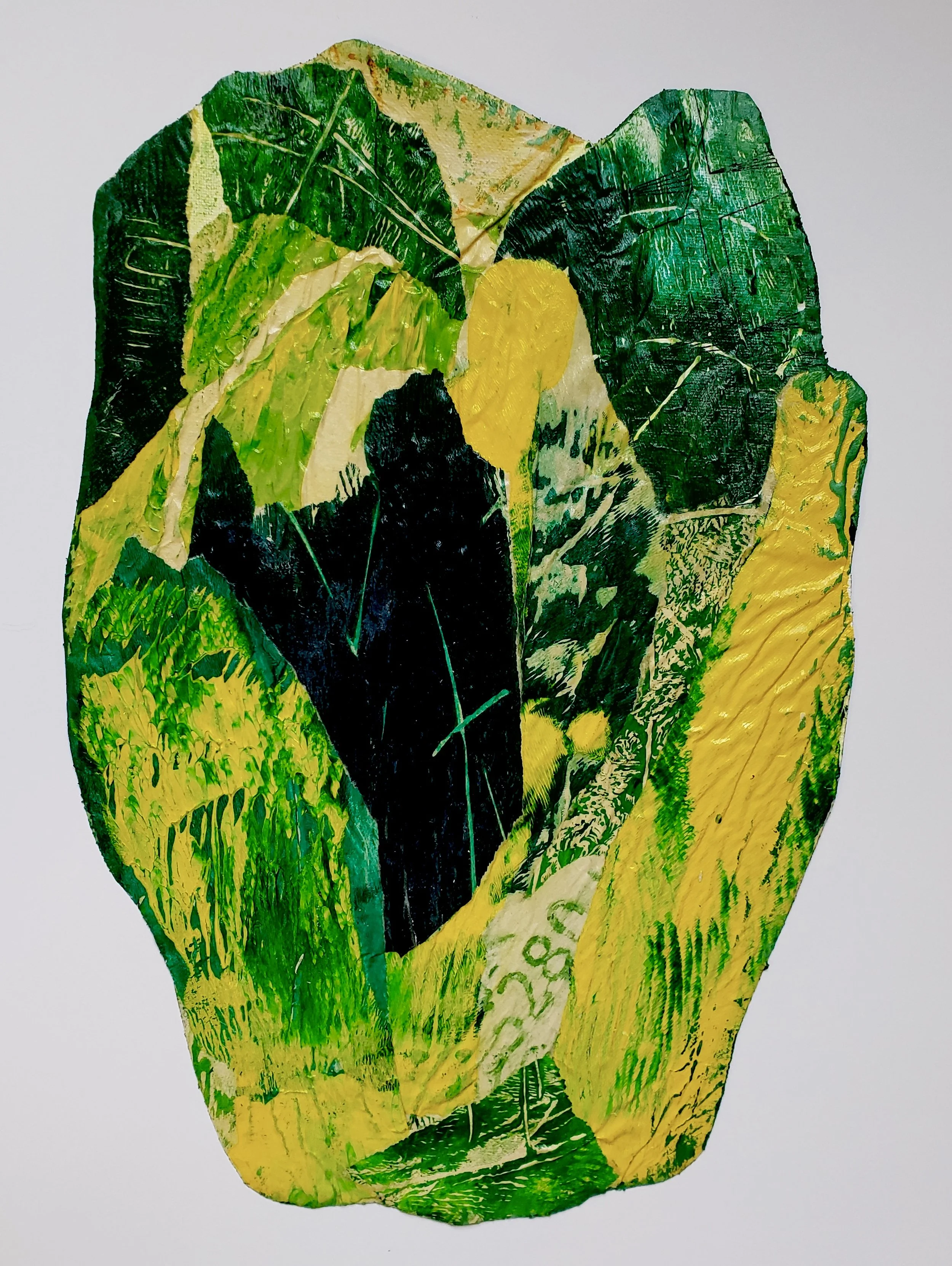 A colorful collage of various green, yellow, and black painted leaves arranged in an abstract pattern.