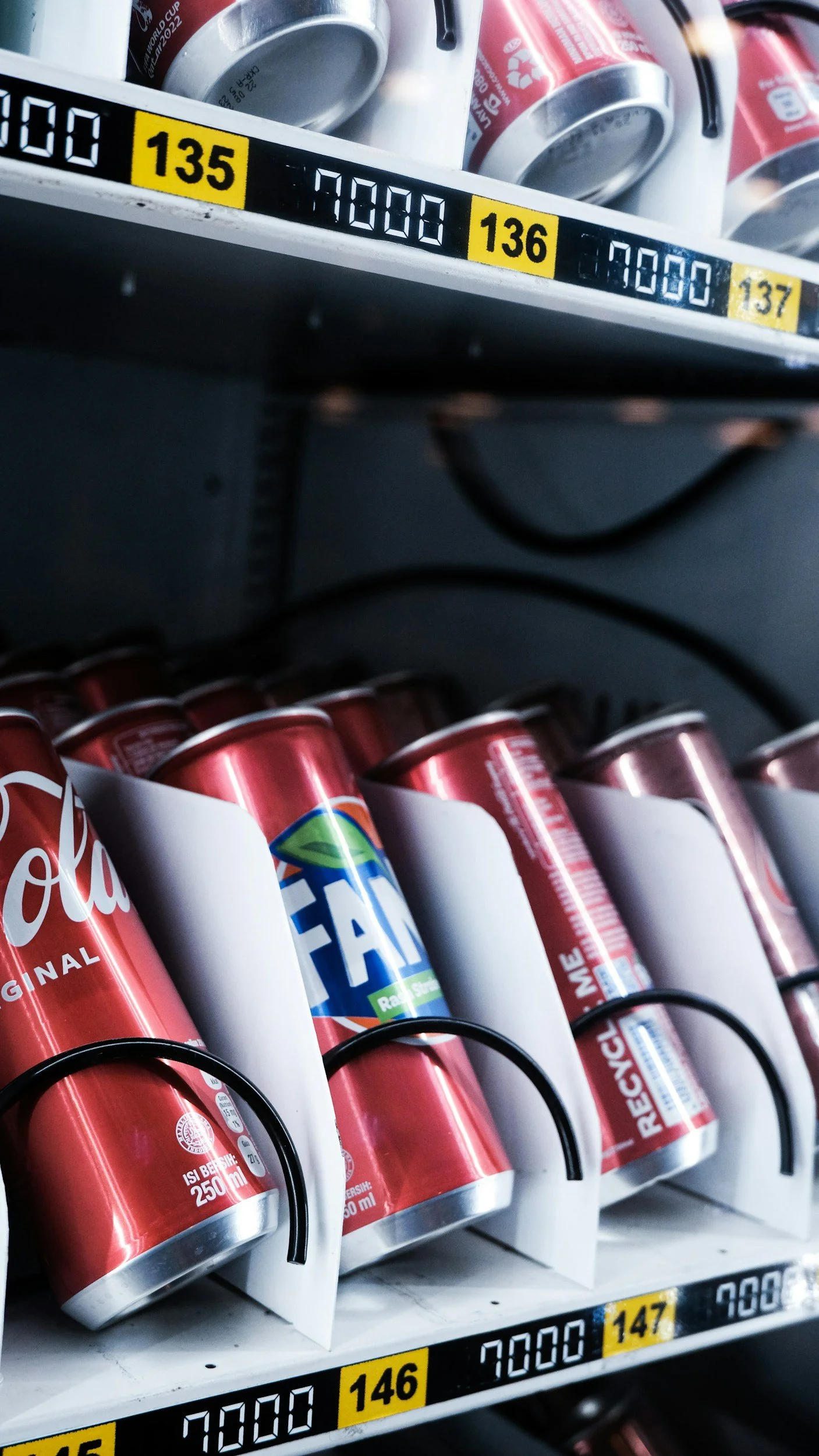 Snack and drink vending machine in New Orleans stocked with Coca-Cola and soda cans, office vending service by Uptown Vending Louisiana