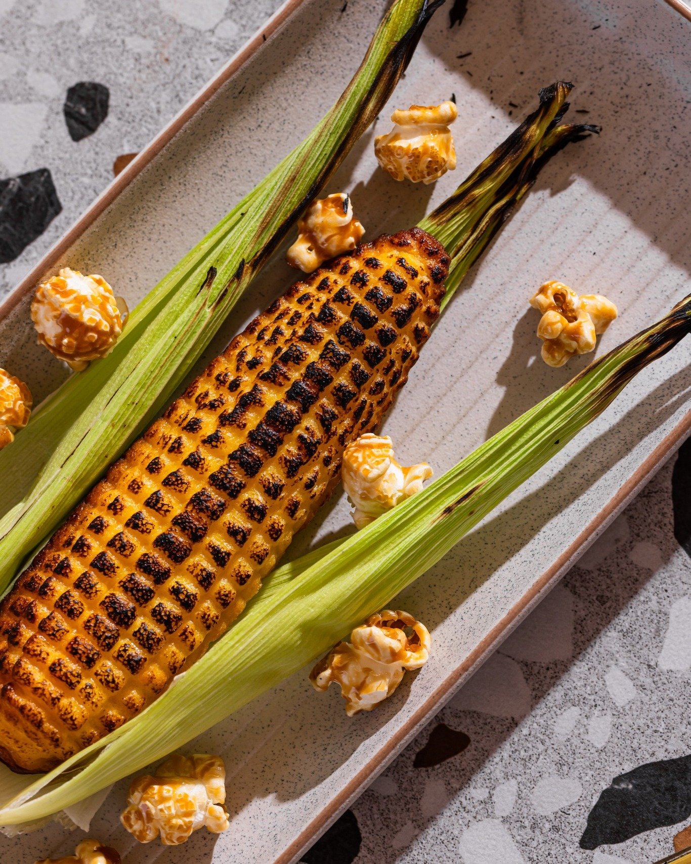 Our Corn Cheesecake is actually made with corn, shaped like corn, topped with caramel popcorn and served warm. Slightly confusing. Very delicious.

Honestly, half the fun is watching it hit the table.

Dessert Sydney | Mexican Food Sydney | Sydney Ea
