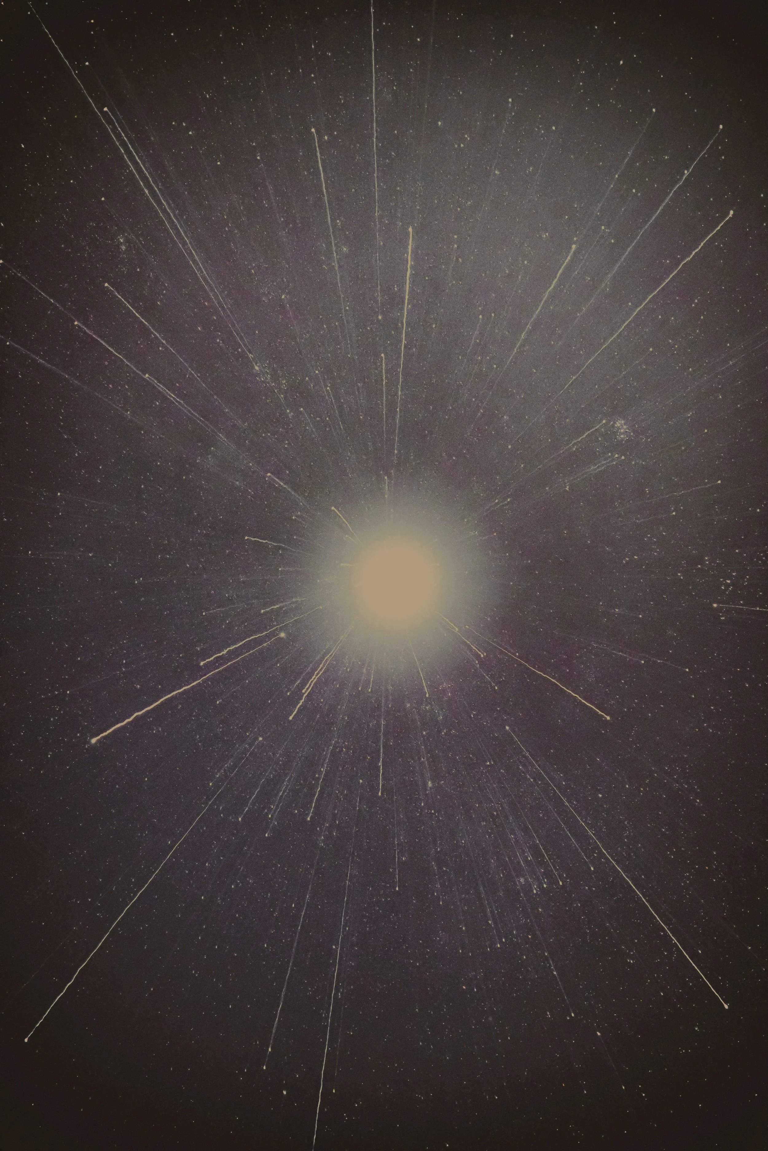 Long exposure photograph of a bright meteor or fireball streaking across the night sky with stars in the background.