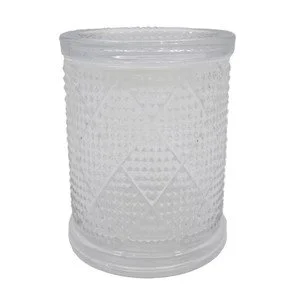 A clear glass candle holder with a textured diamond pattern.