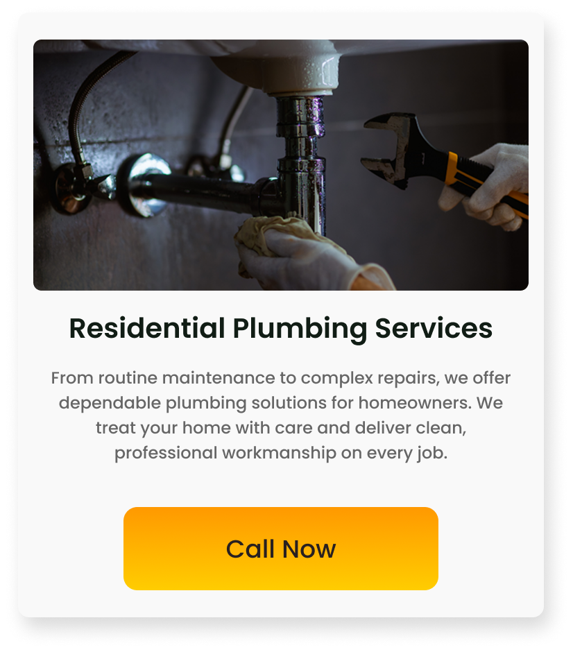 A person wearing white gloves holding a pipe wrench and working under a sink with plumbing pipes visible.
