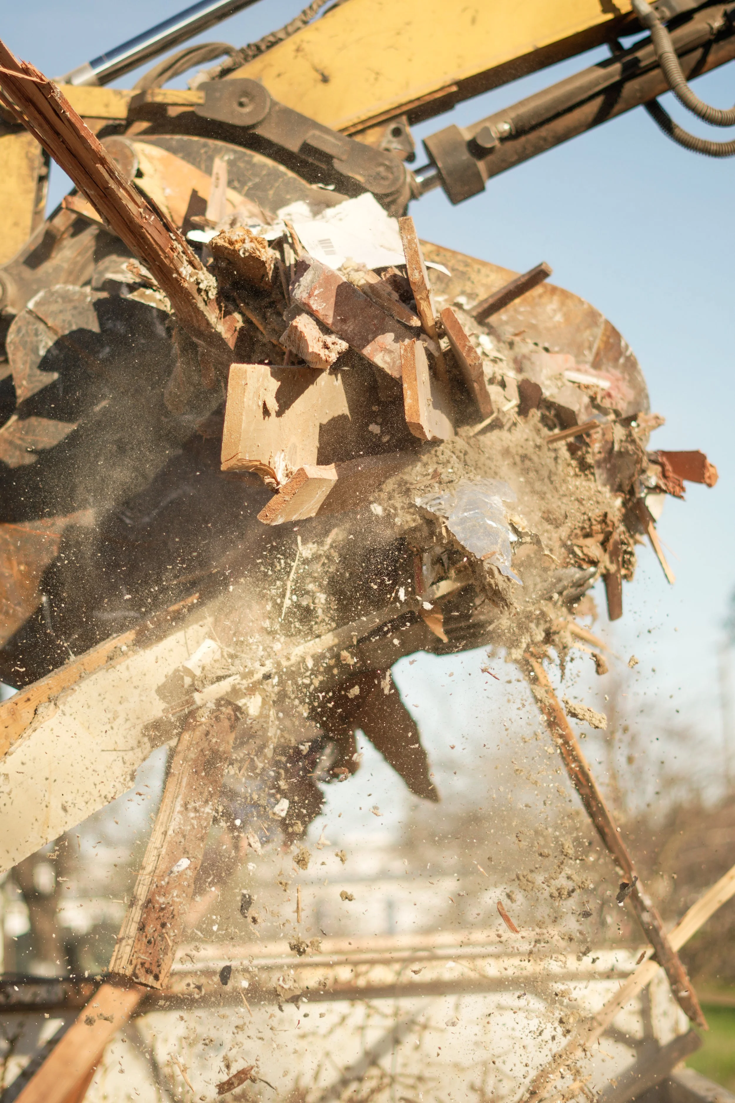 Excavator performing professional demolition services in Redding California by Easy Cleanups
