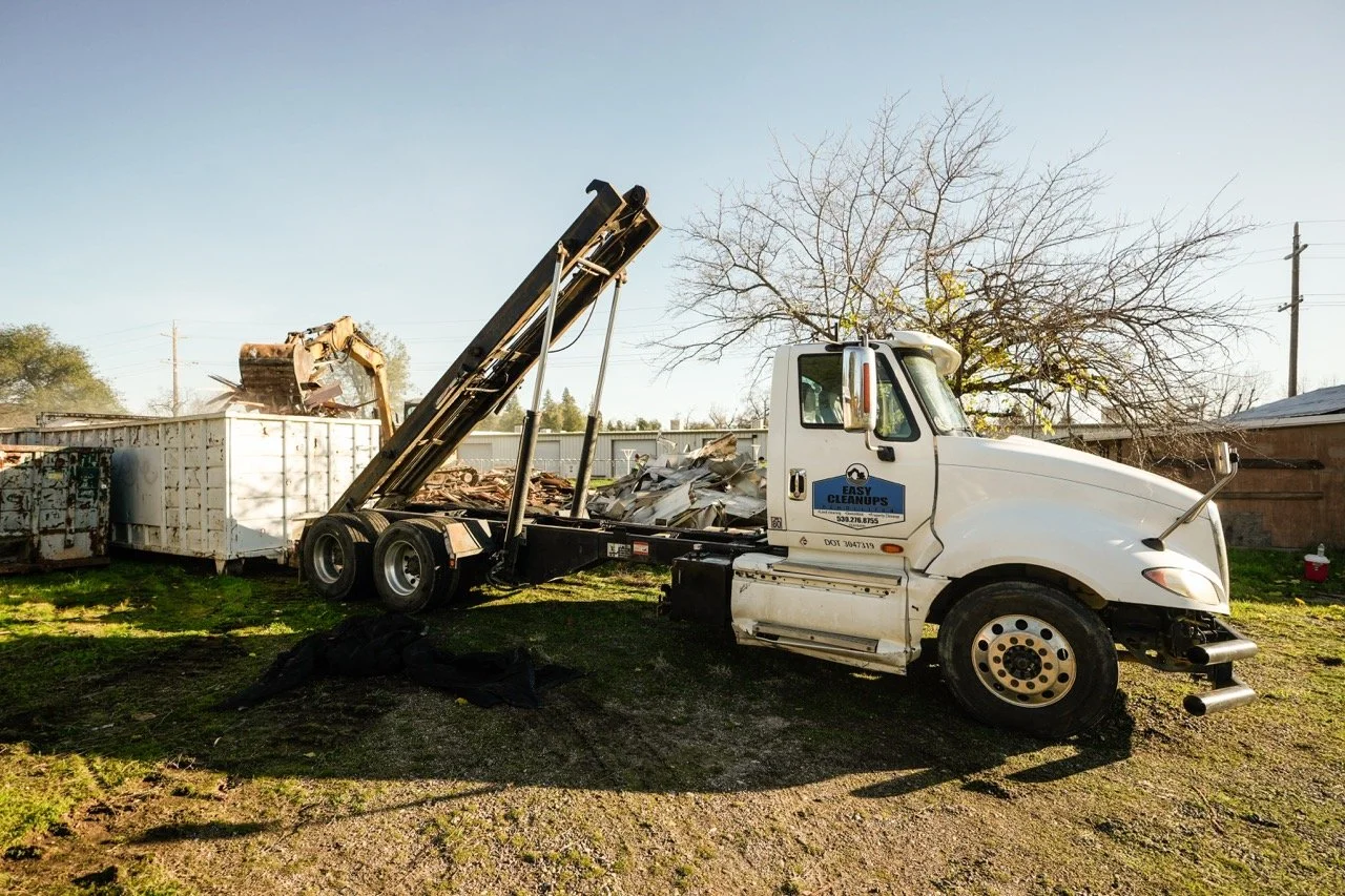 Dumpster rental placed on residential driveway for cleanup project in Redding CA