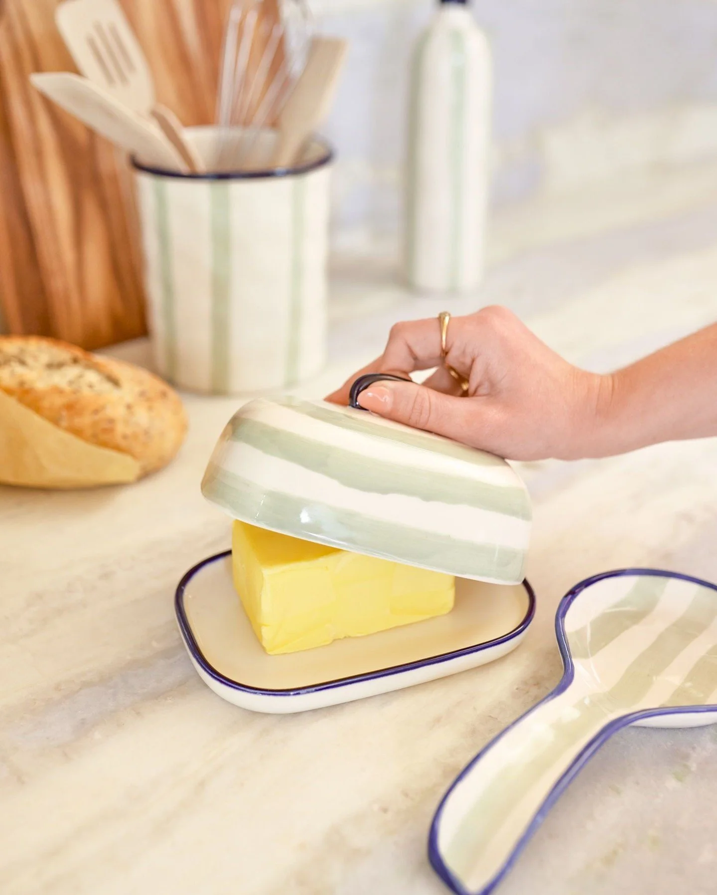 Sage-green stripes and deep navy rims give the Sable collection a splash of easy-going charm.

Made from stoneware with gentle, tactile dimples, each piece brings a touch of rustic warmth to everyday cooking and serving.