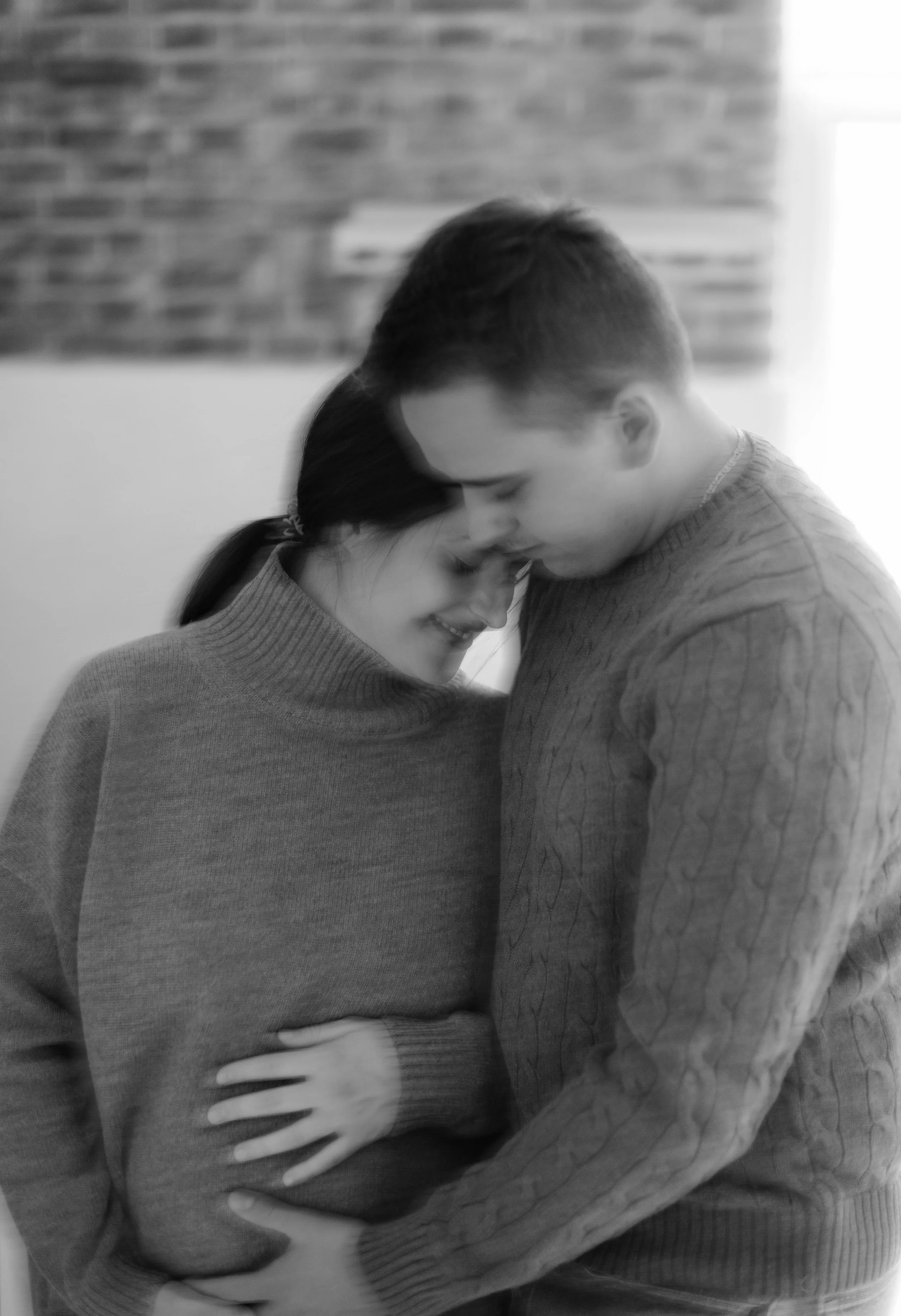 Cis couple embracing, , brand photography for Rachael Benjamin Therapy.