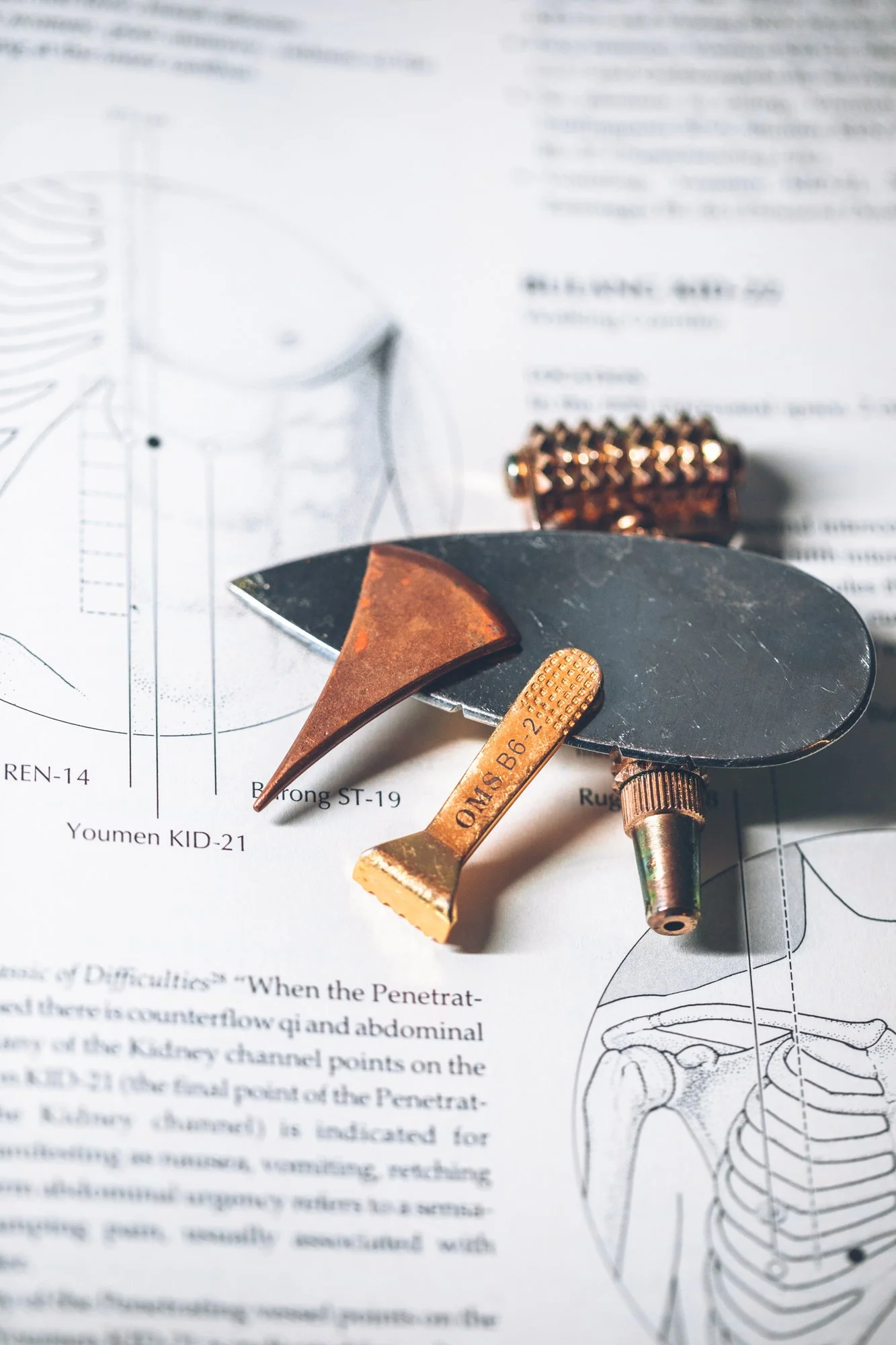 Close-up of acupuncture and Chinese medicine tools.