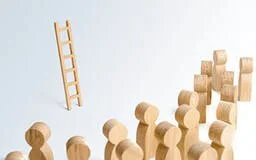 A wooden ladder suspended in mid-air above a group of wooden blocks arranged on a plain background.