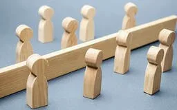 Conflict management image - two groups separated by a barrier