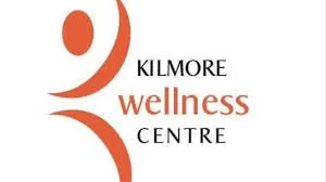 Logo for Kilmore Wellness Centre with stylized red and black design elements and text.