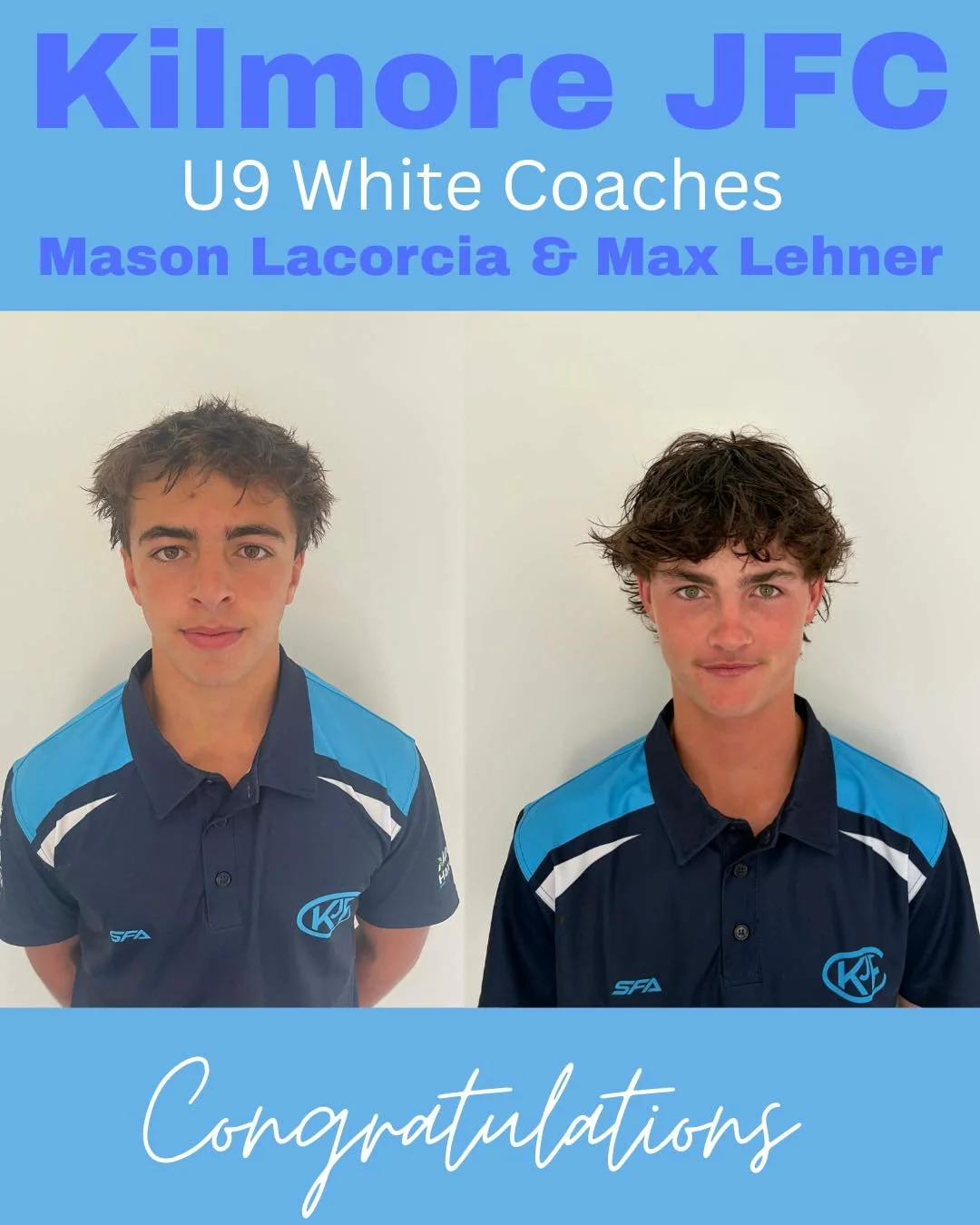 Two young male tennis players wearing blue and black team shirts with logos, standing against a white wall, with one having slightly tousled brown hair and the other with curly brown hair.