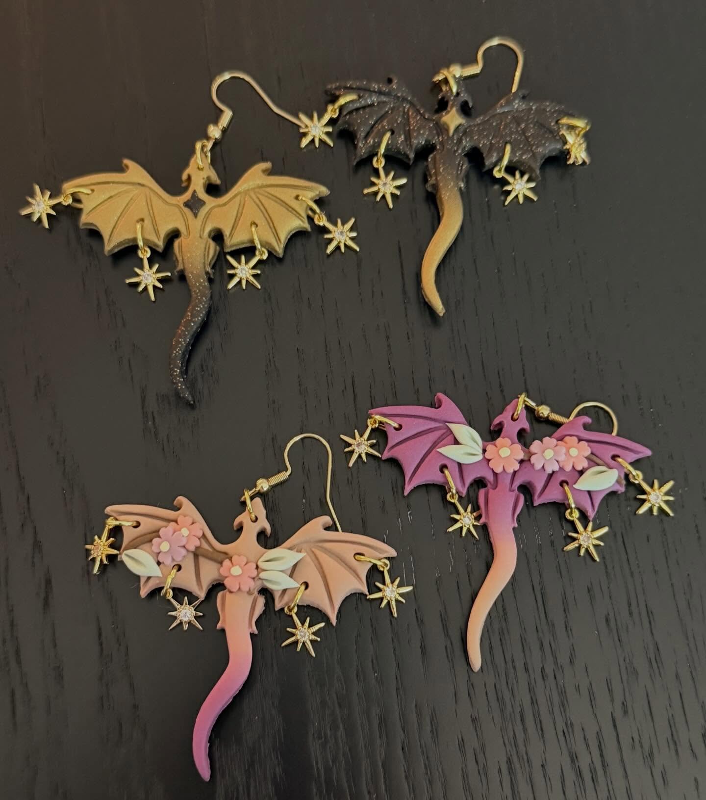 Ten days ago I turned in my edits for the companion to When Dealign with Dragons and to treat myself on the same day I ordered these two sets of dragon earrings from @peripheral.shop! And they have arrived! 

@wordsiren told me about this creator and