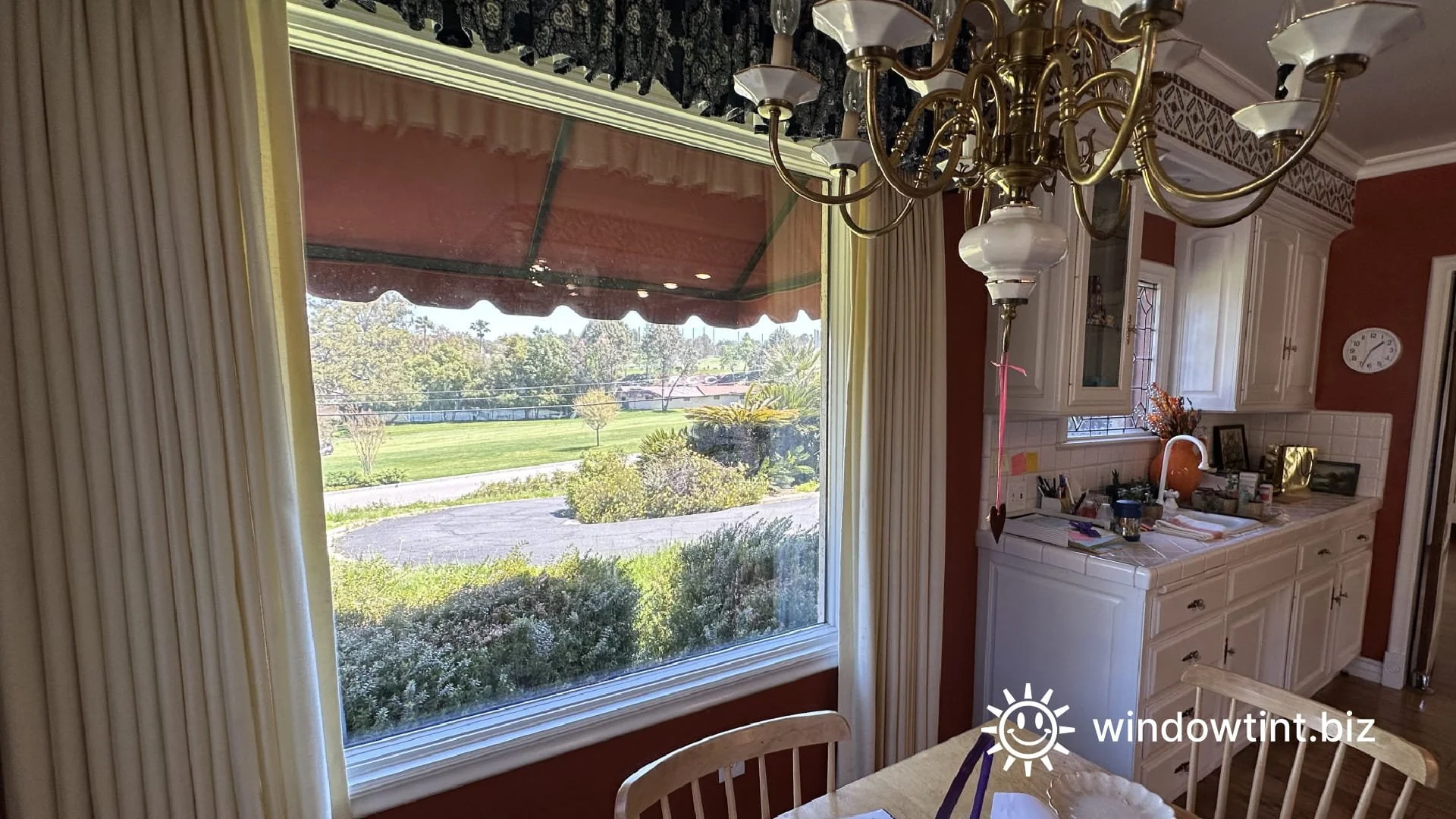 Heat-rejecting clear window film installed on large living room windows in Redlands, CA to improve comfort without changing window appearance.