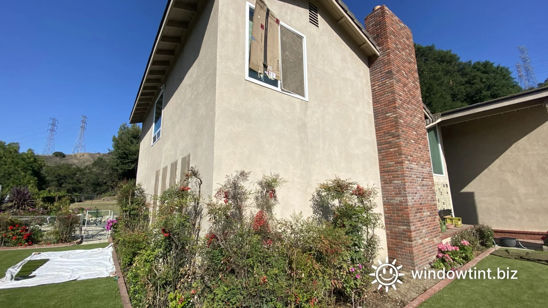 Sun reflection from residential windows melting backyard turf in Temecula California
