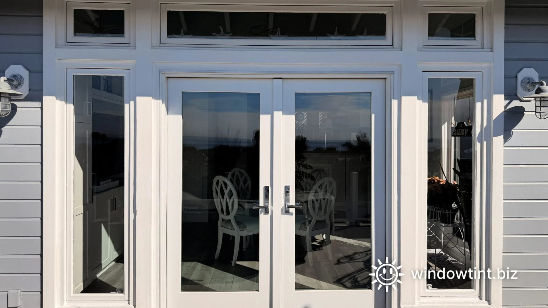 West-facing French doors with sidelights and transom windows in a San Clemente