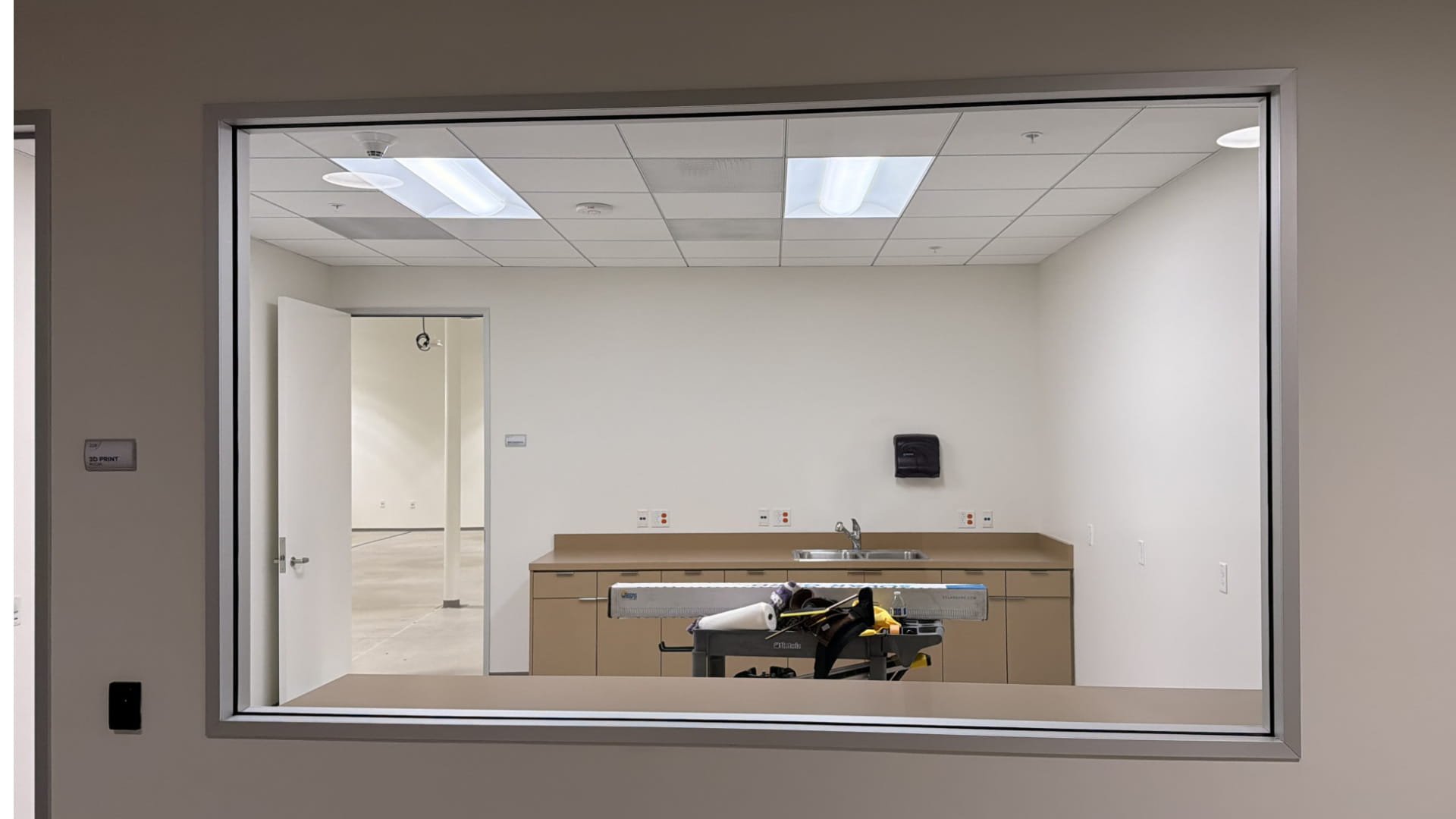 Clear glass interior window before frosted window film installation for studio privacy in Glendale CA office space