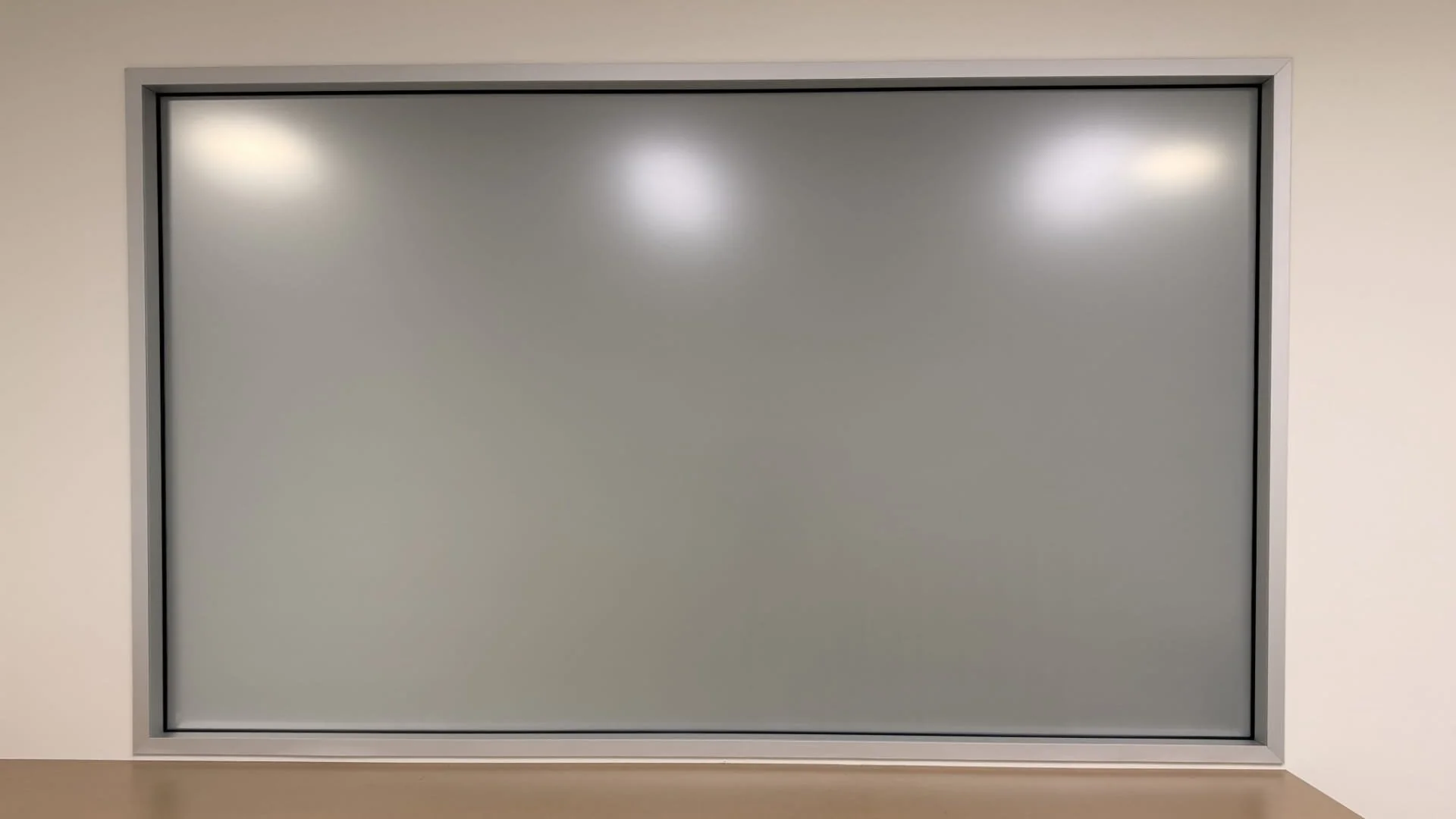 Comparison of clear glass vs frosted window film showing privacy added to office window in Glendale CA commercial space