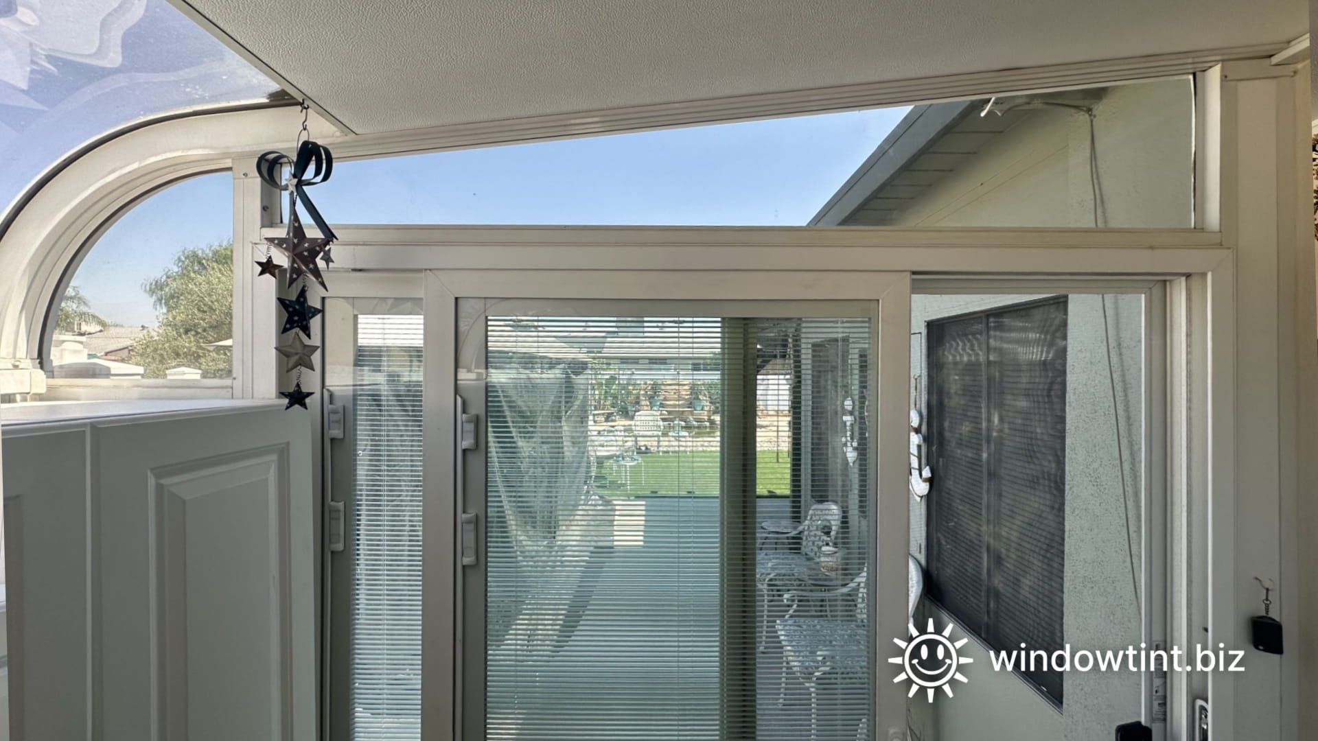 Window film applied to curved sunroom windows to improve comfort in a Southern California residence.