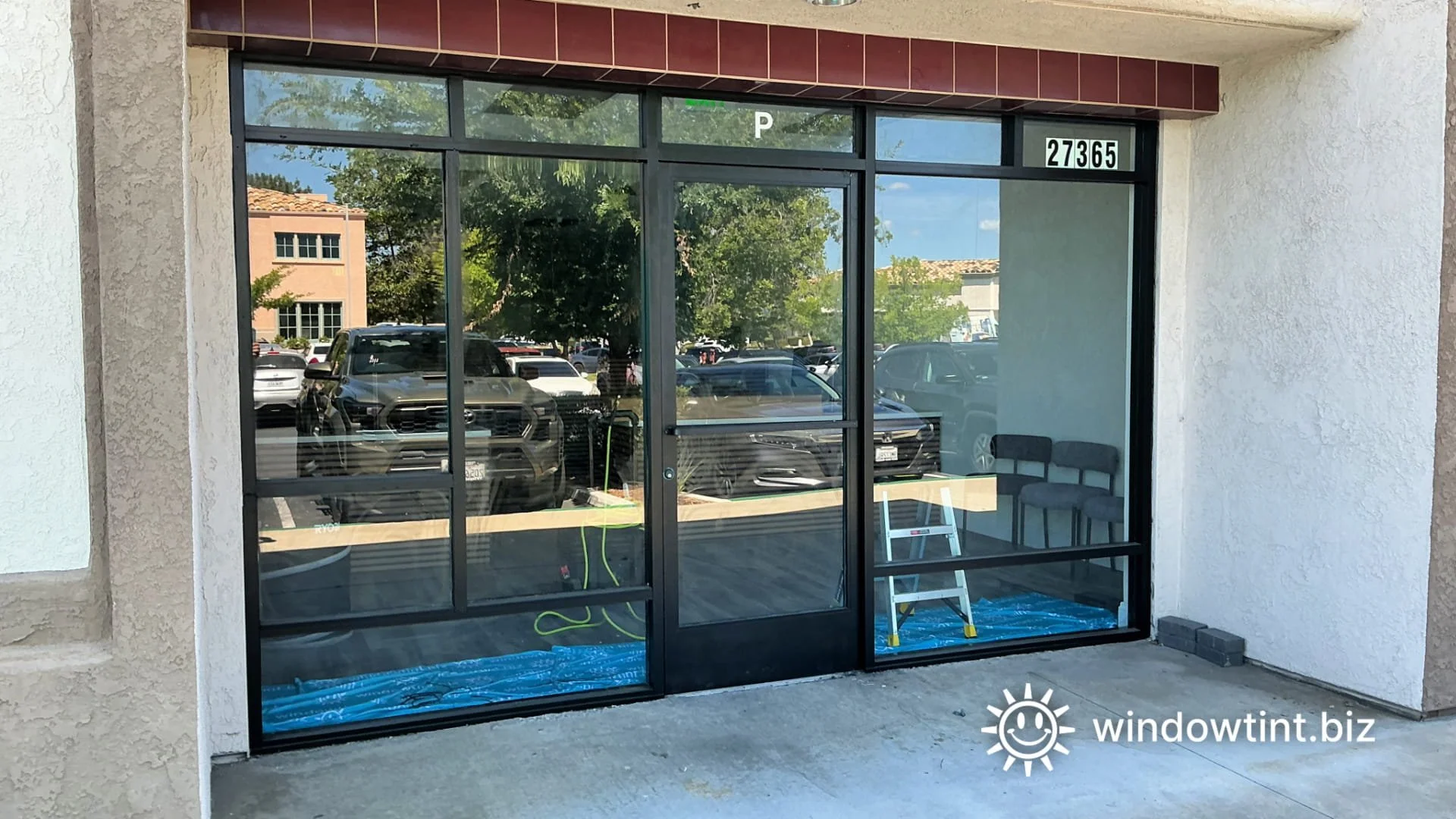 Exterior view of storefront window film installation in Temecula CA for commercial glass privacy and glare reduction