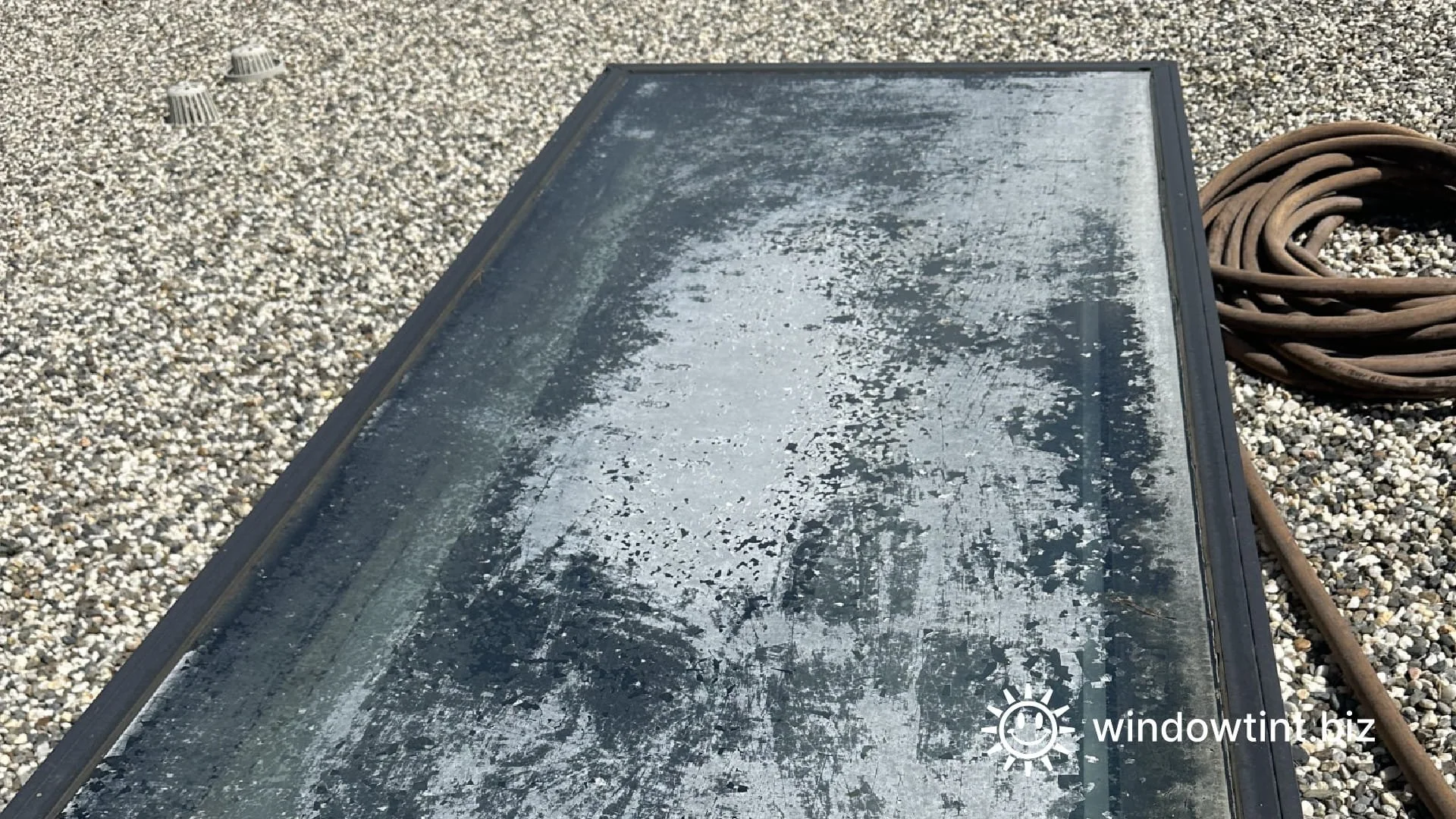 Cracked and deteriorating skylight window film in a Los Angeles home before removal and replacement with new frosted window film.