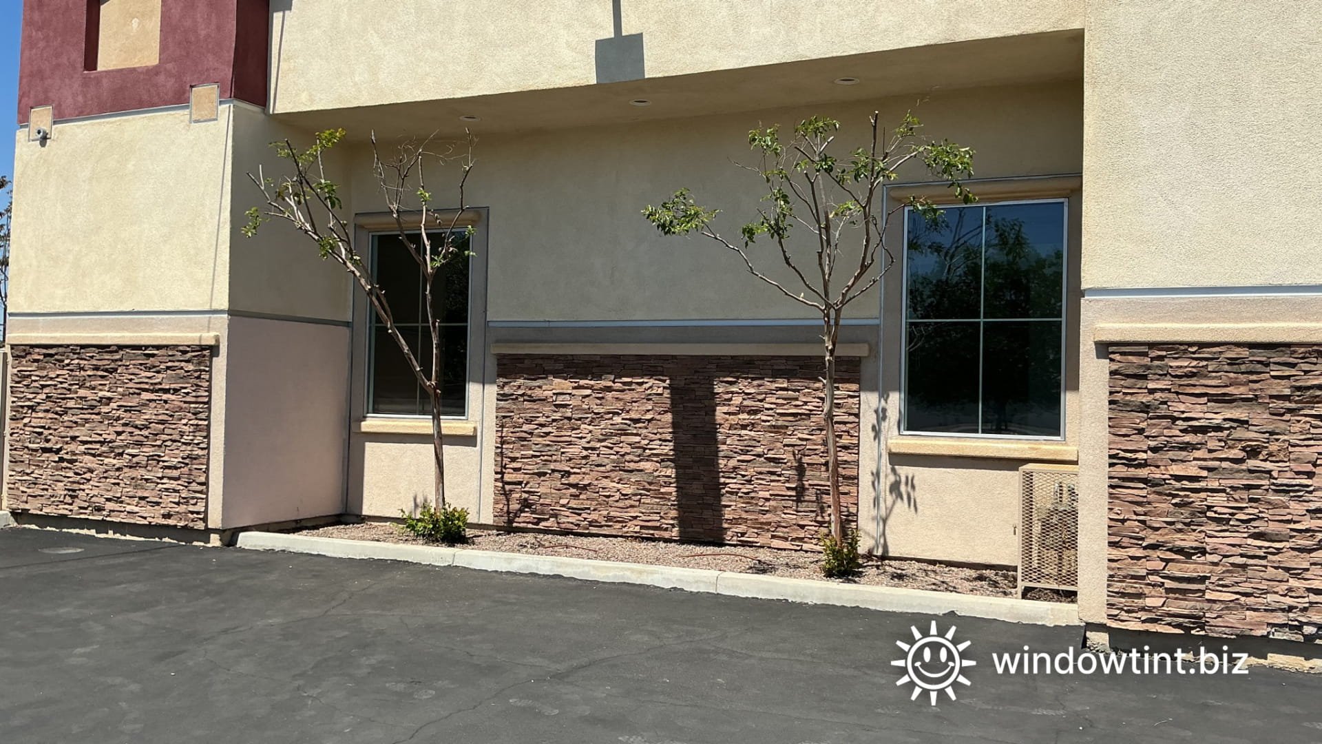 removing old anti graffiti window film from commercial windows Hemet CA showing worn cloudy film