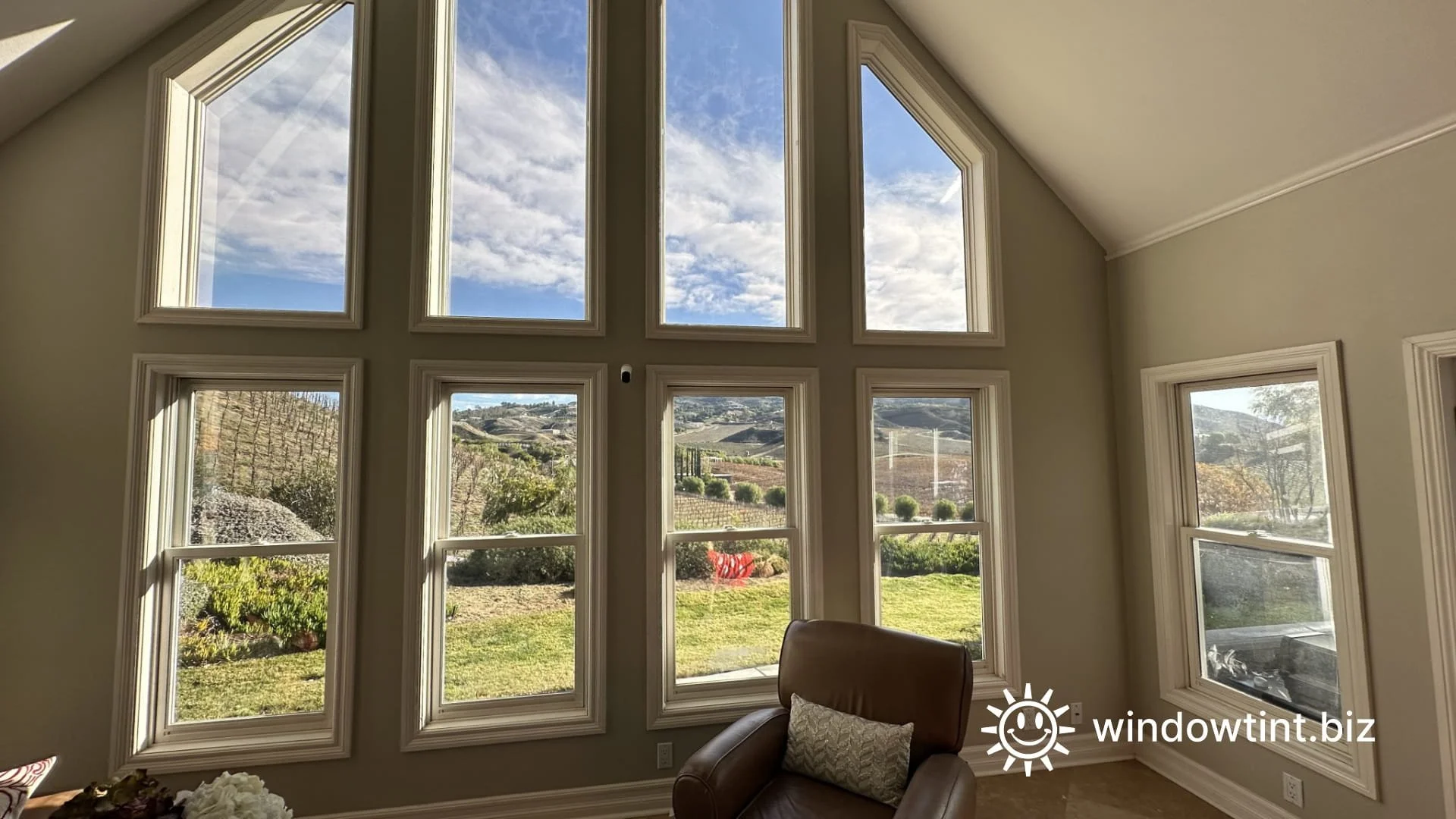 Home window tinting in Temecula California reducing heat and glare in a living room with large windows while maintaining clear views and natural daylight