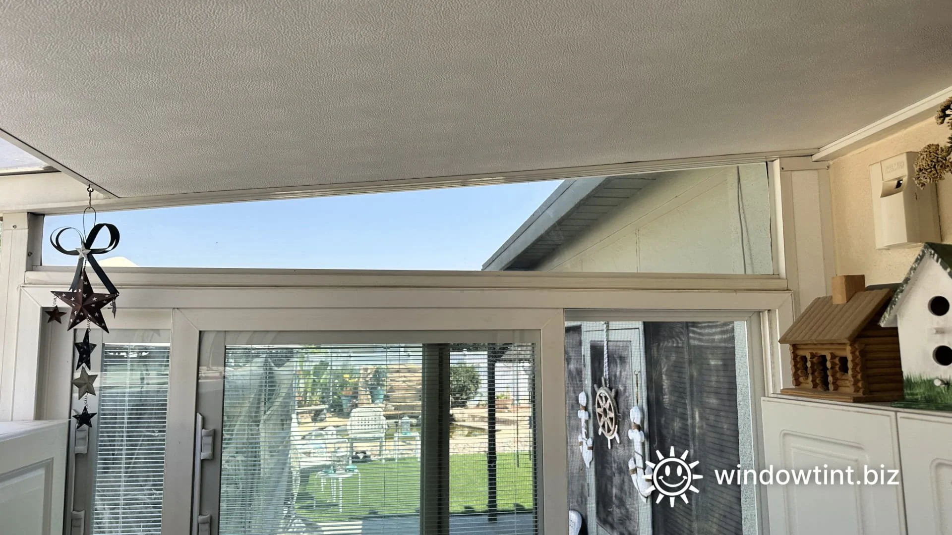 Curved glass sunroom with window film reducing glare in a Rancho Cucamonga area home.