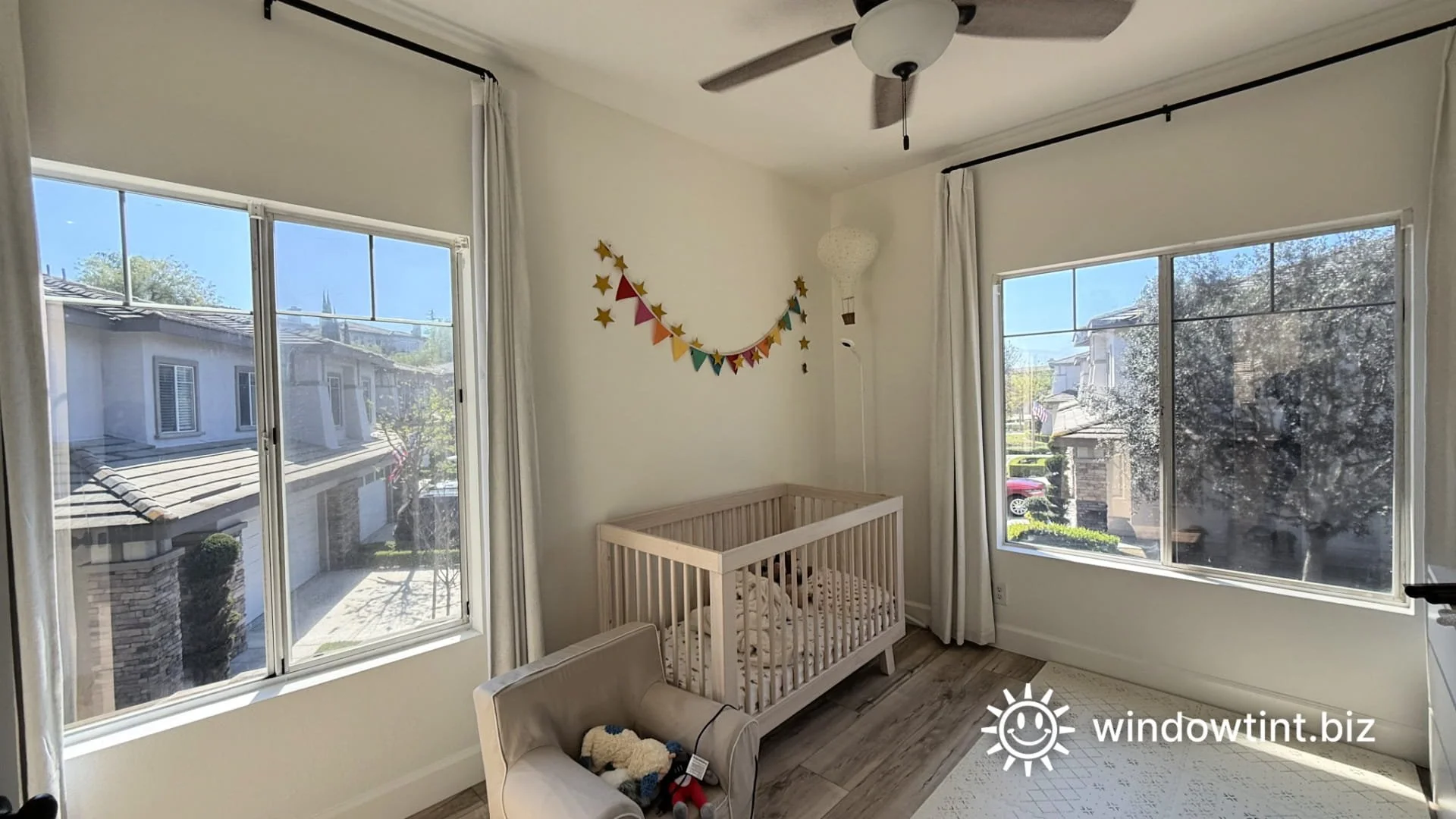 nursery room with large windows in Coto De Caza home before window tinting glare reduction