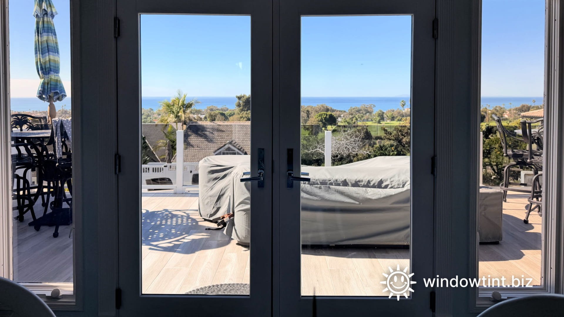 View from inside San Clemente home looking out through a window with window film installed, maintaining clear views and natural light.