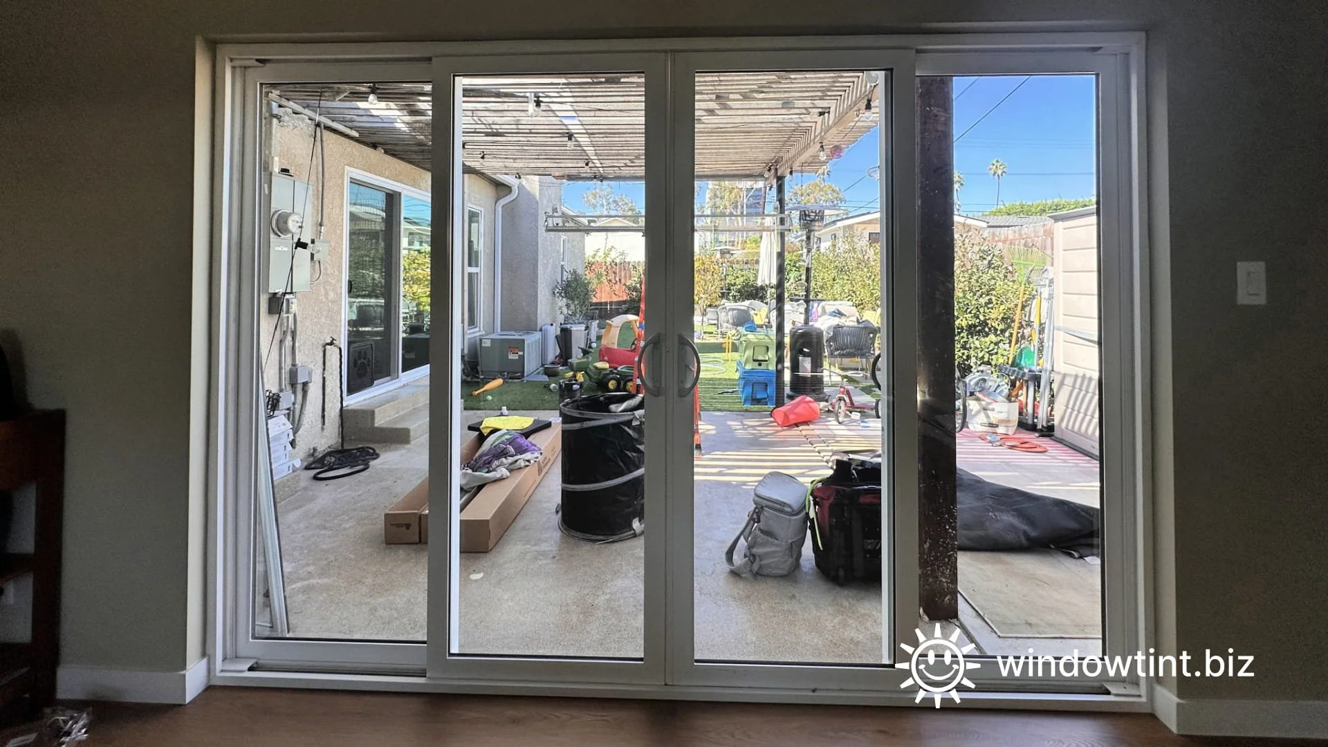 Home window tint installation in Marina del Rey CA showing dual reflective window film applied to sliding glass doors for heat reduction, glare control, and daytime privacy.