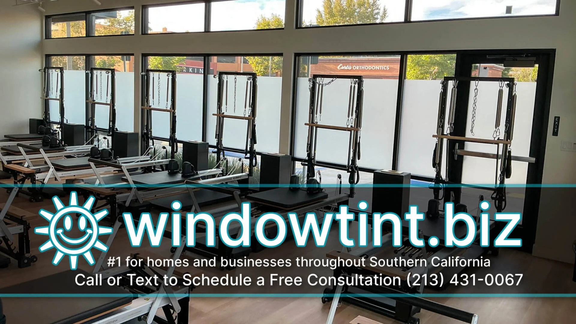 Frosted privacy window film installed on large glass windows at a Pilates studio in Brea, California.