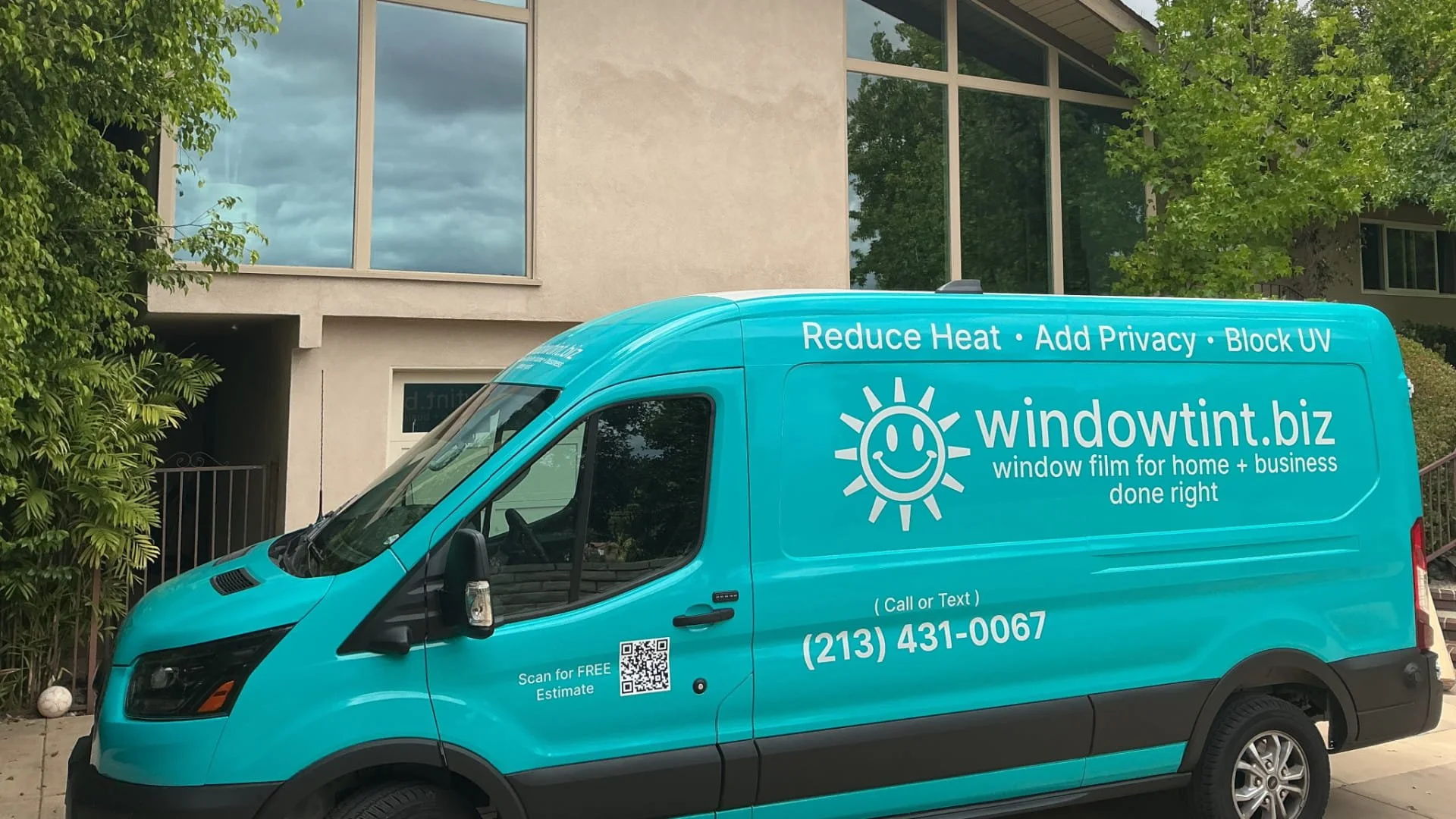 WindowTint.biz van outside Santa Ana home after Huper Optik window film installation