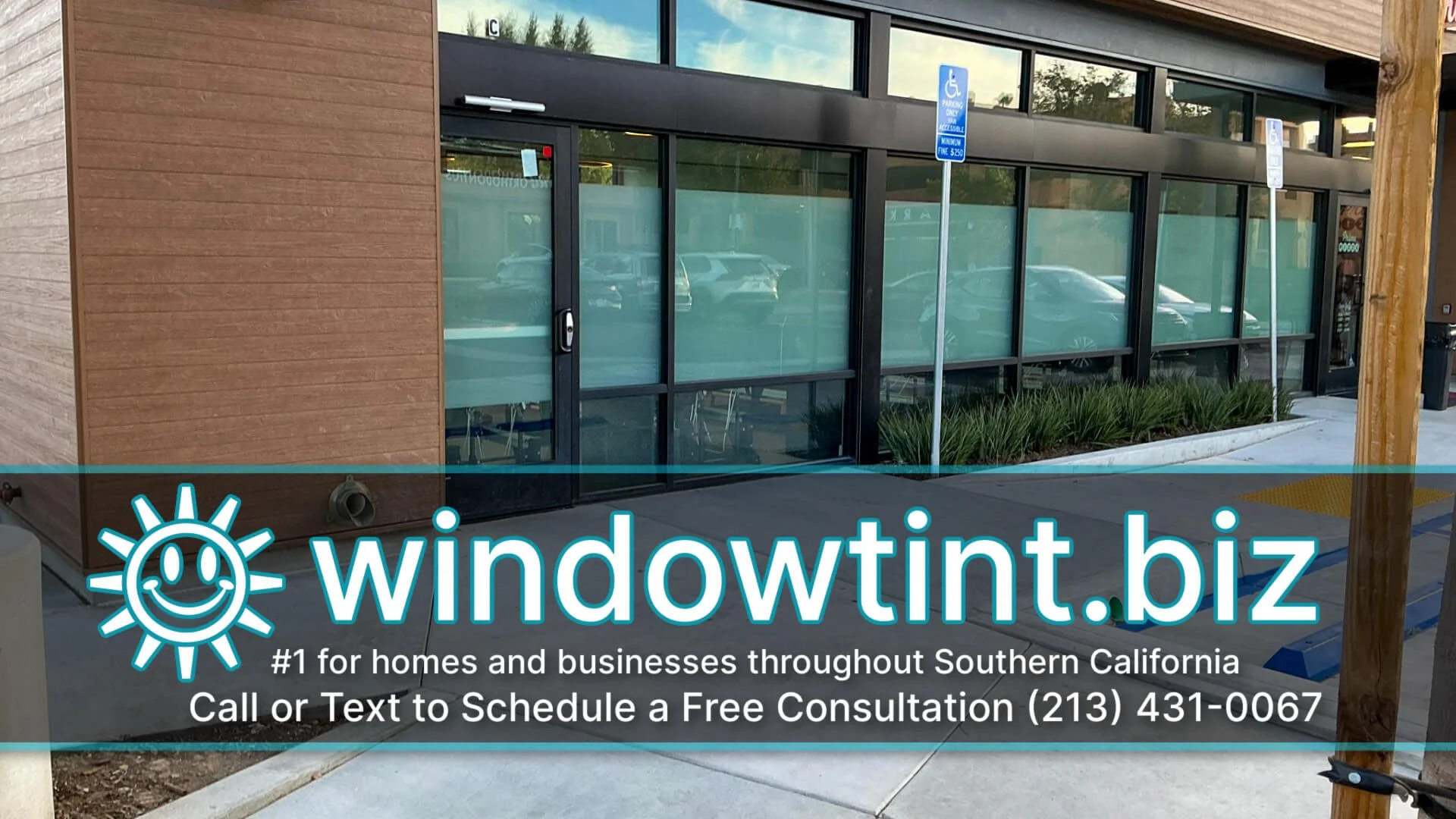 Frosted window film on studio glass with clear sections above and below to maintain an open feel.