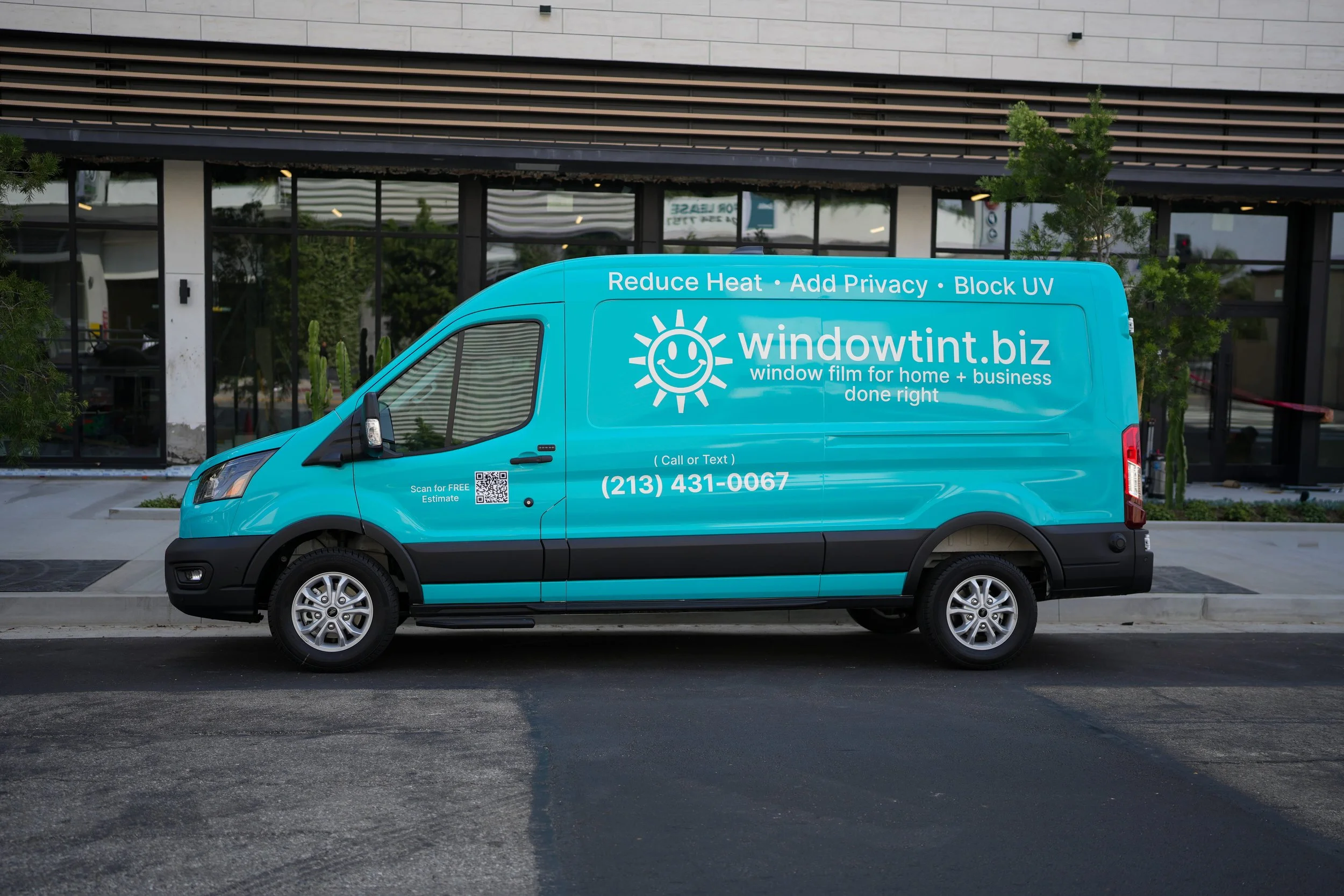 WindowTint.biz service vehicle on site for commercial storefront window protection and anti-graffiti film installation