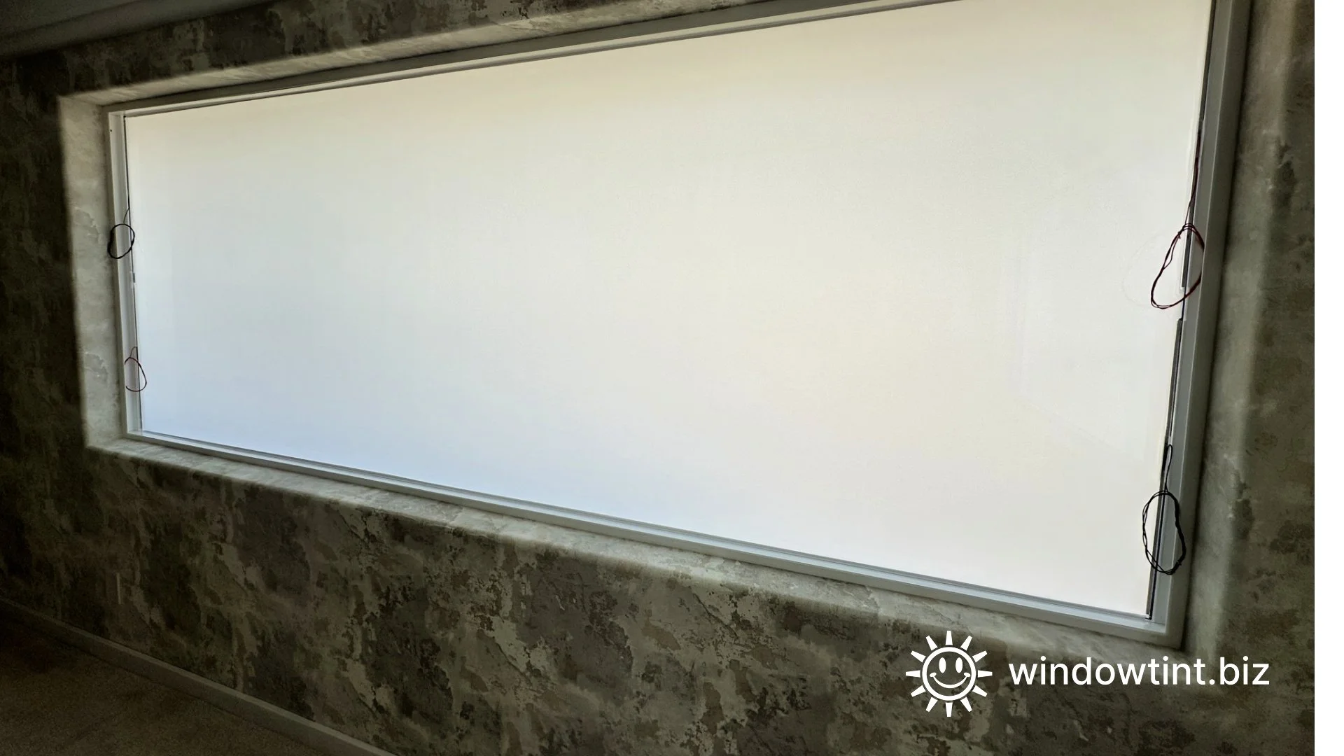 Interior view of residential smart tint windows in frosted privacy mode inside luxury home