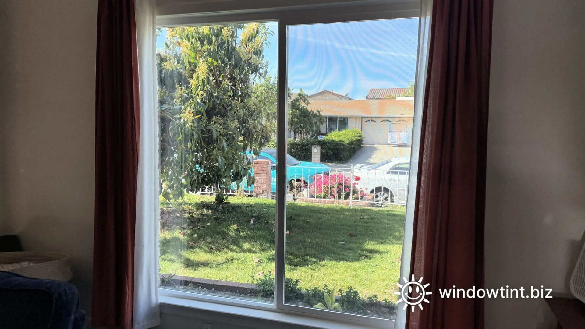 Living room window before tint showing bright sunlight and glare entering home in Los Angeles
