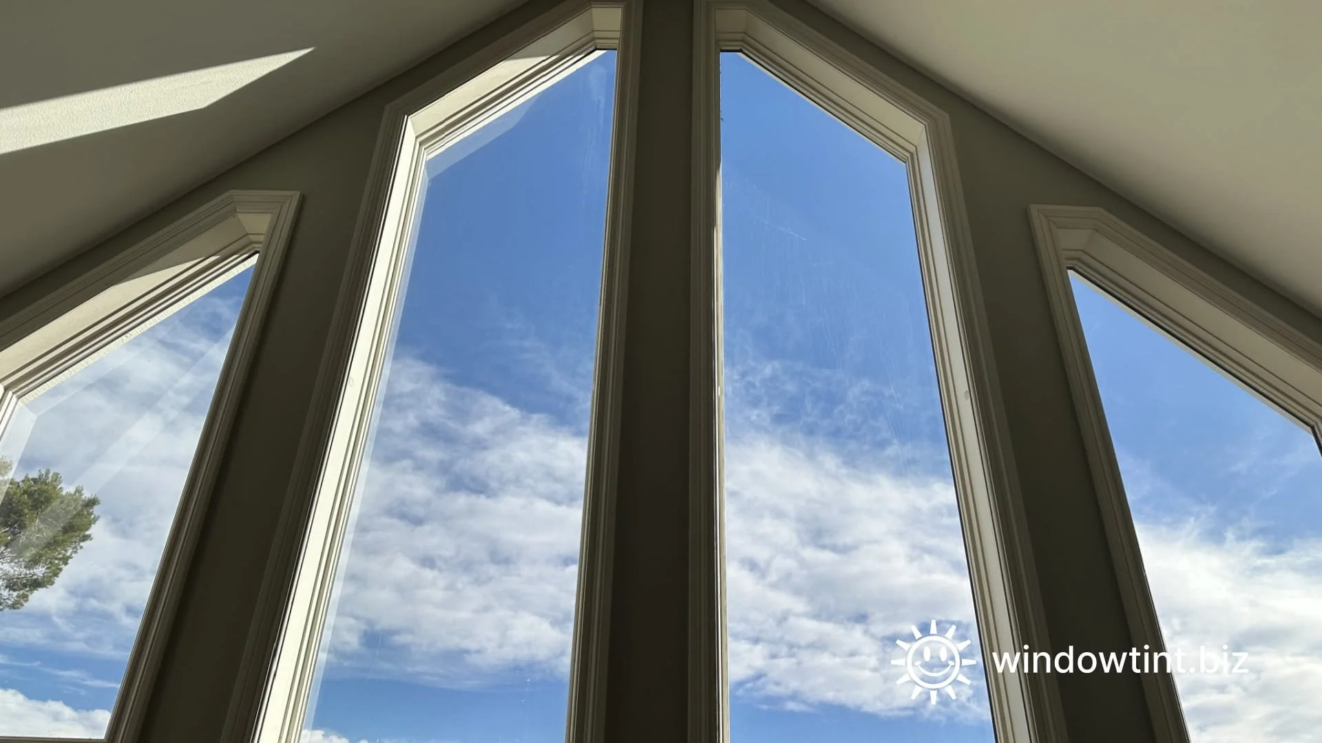 Clear residential window film on tall living room windows in Temecula CA to reduce solar heat gain without darkening the glass