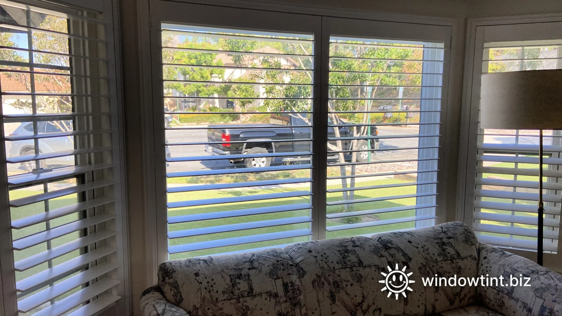 Artificial turf melting caused by concentrated window reflection near a residential home.