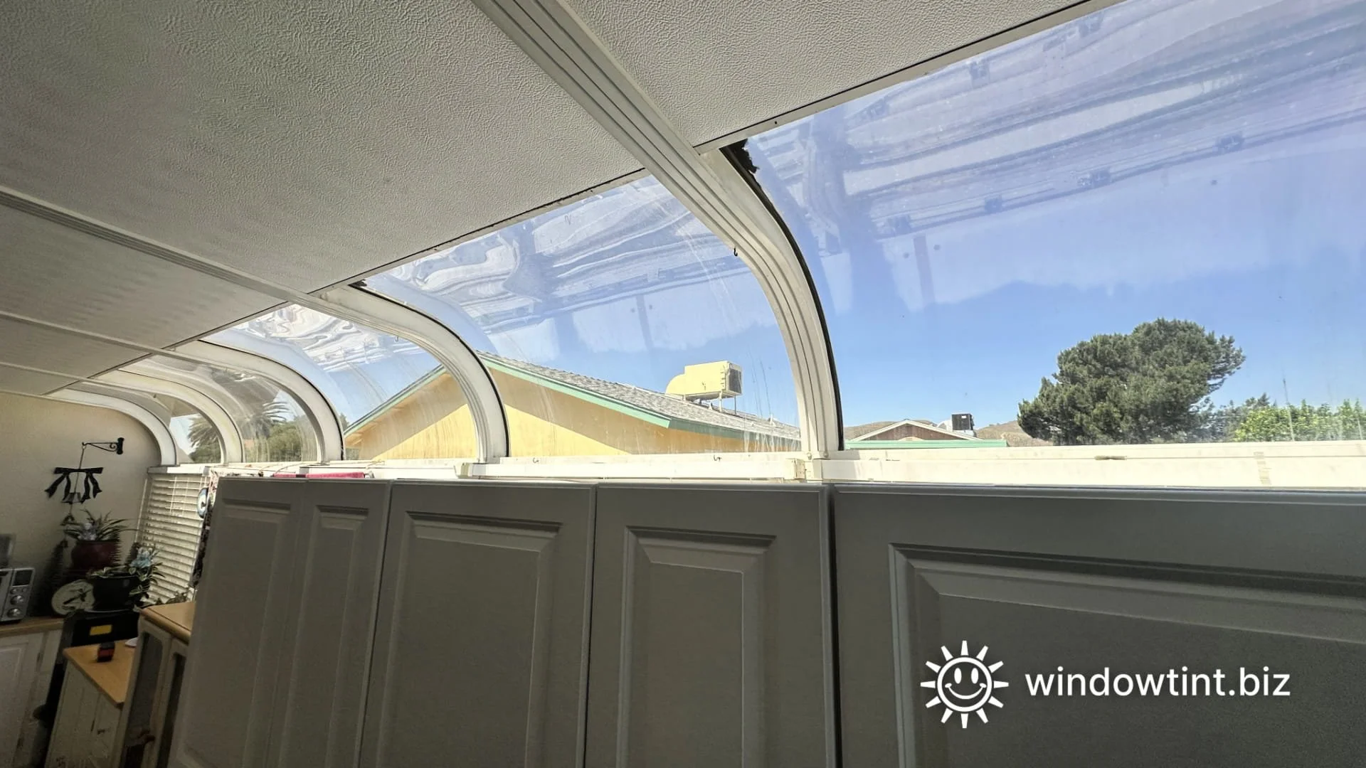 Sunroom window film installed on curved glass to control heat in a San Fernando Valley residential home.