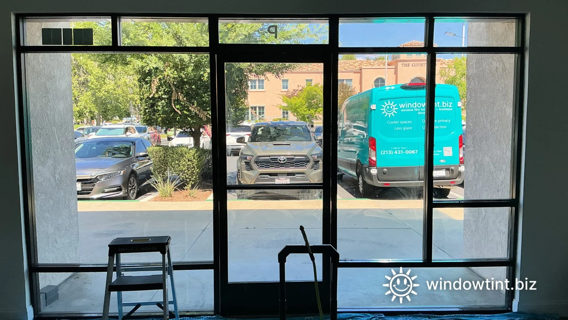 Interior view of commercial storefront window tinting installation in Temecula CA 92590 for heat reduction glare control and daytime privacy