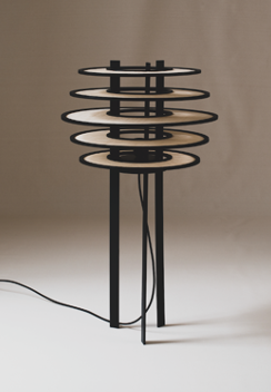 A modern floor lamp with circular light rings stacked on top of a black stand, against a neutral background.