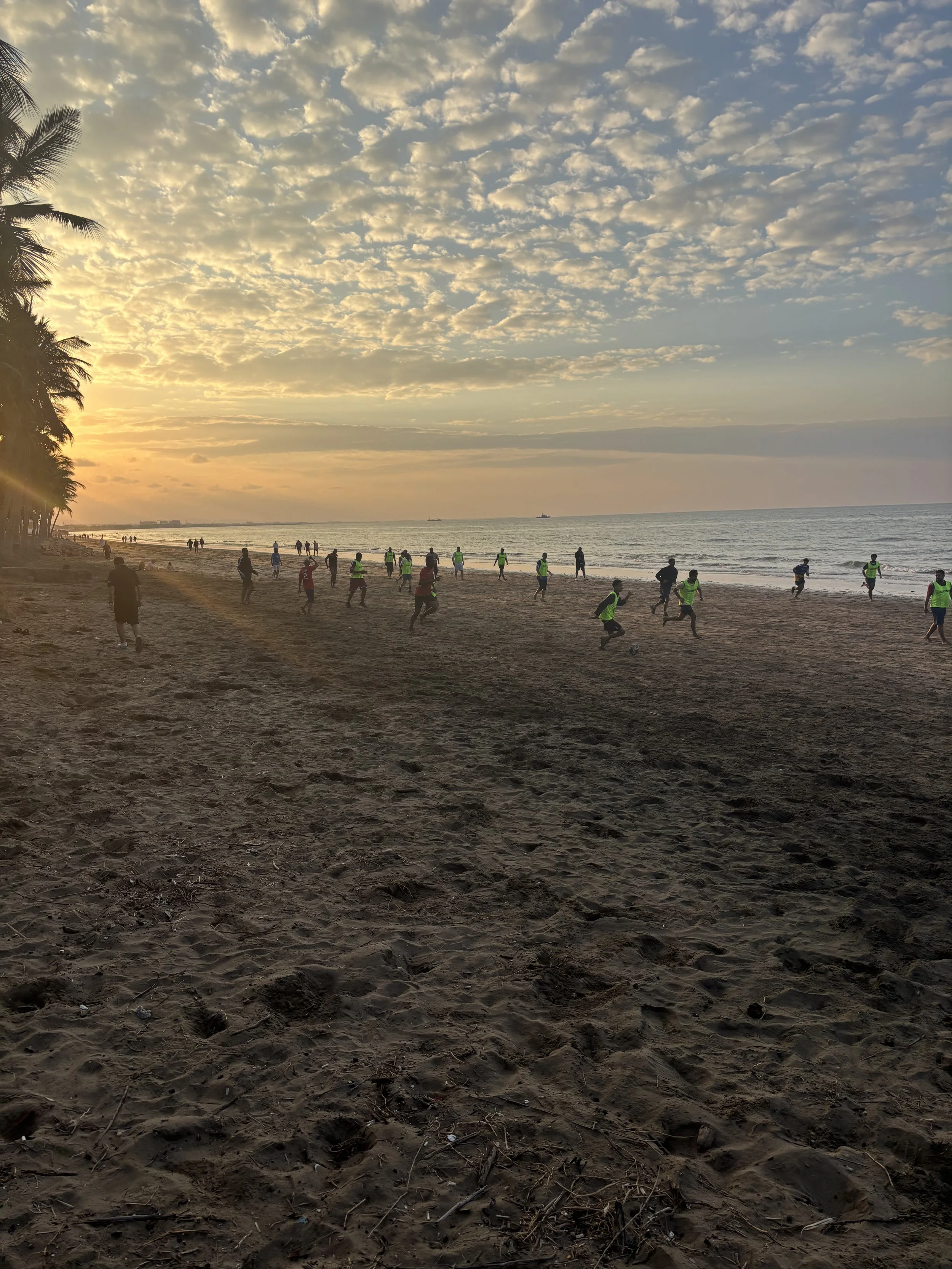 Community teams playing football on Qurum Beach - Muscat, Oman