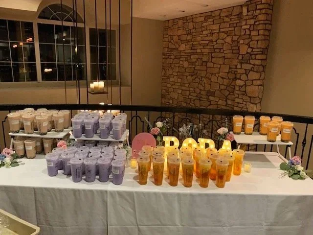 a spread of boba tea drinks displayed on a table