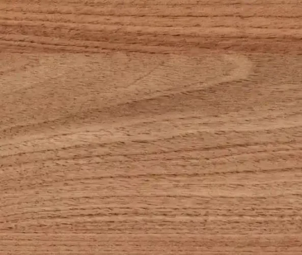 Close-up of a wooden surface or table with a smooth texture and natural wood grain pattern.