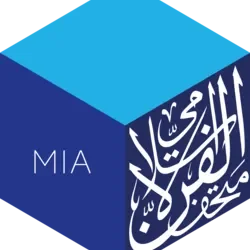 Logo with a blue 3D cube, the word 'MIA' on one side, and Middle Eastern script on another side.