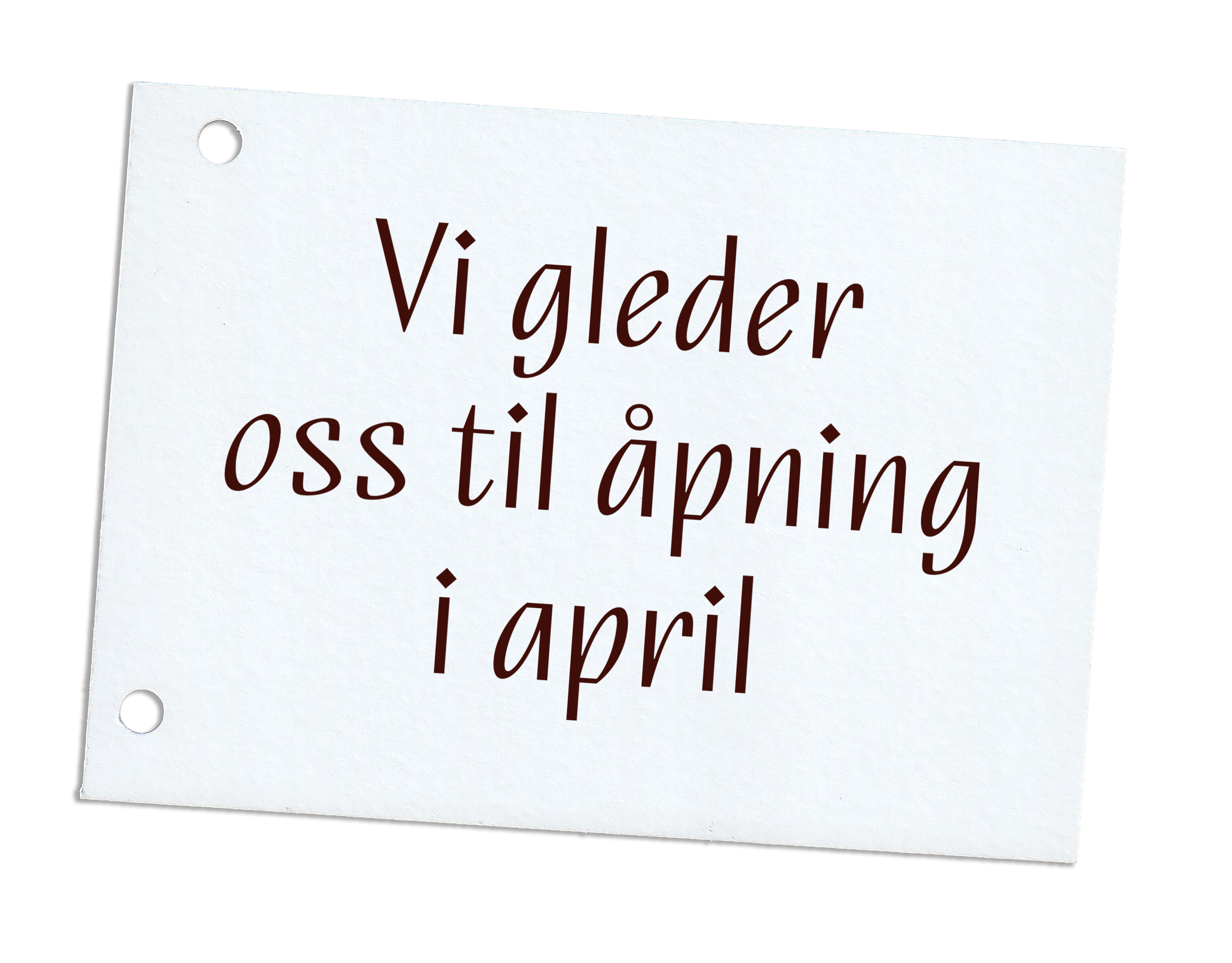 En papirlapp med hull fra hullemaskin og teksten "Vi gleder oss til åpning i april".