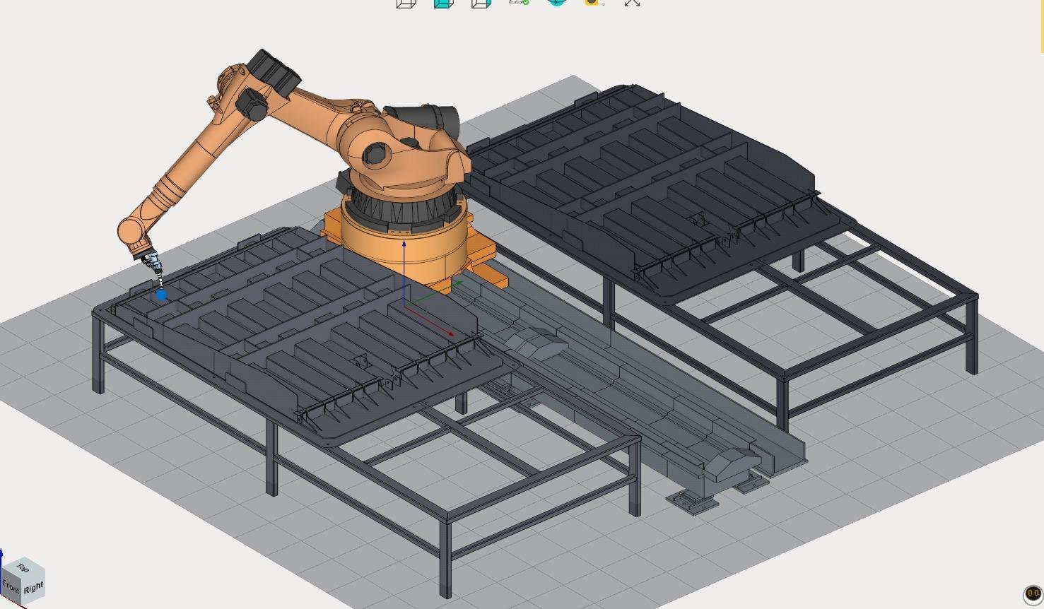 İşlem masası ve robot kolu ile otomasyon üretim alanı.
